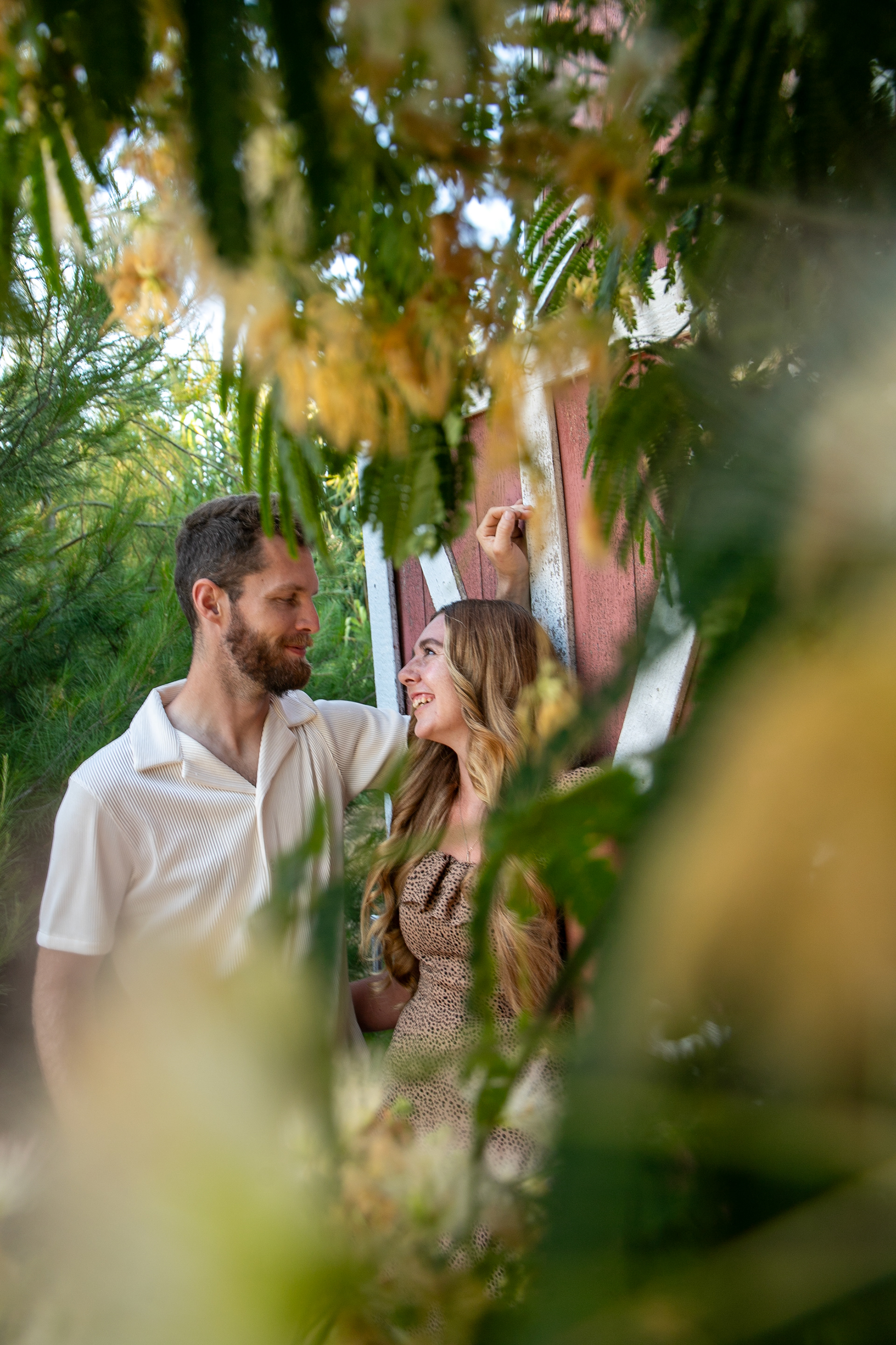 Just two kids looking at each other in love in a garden.