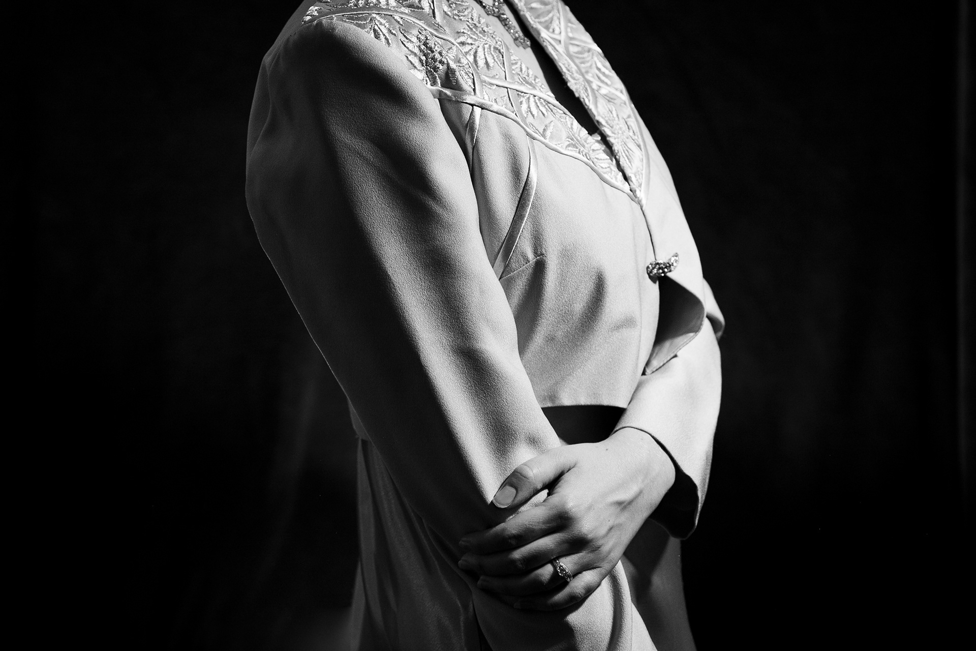 Studio lighting makes this retro ensemble dress stand out and show the details of the embroidery.