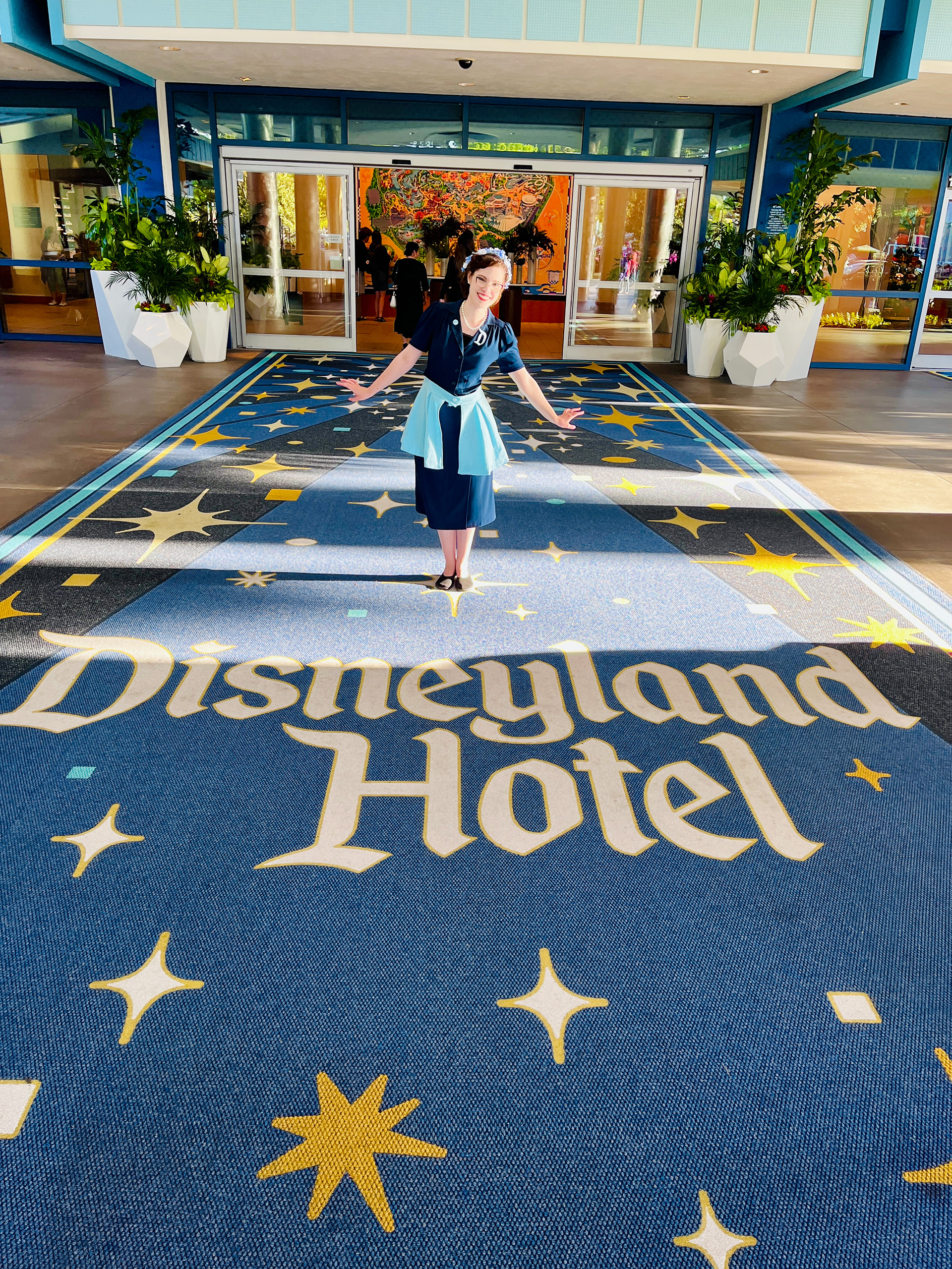 Picture of Kaytie dressed in her 1950's styled outfit Disney bounding as the Disneyland Hotel. 