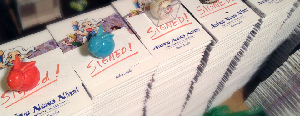A photo of stacks of signed books for the Kickstarter campaign