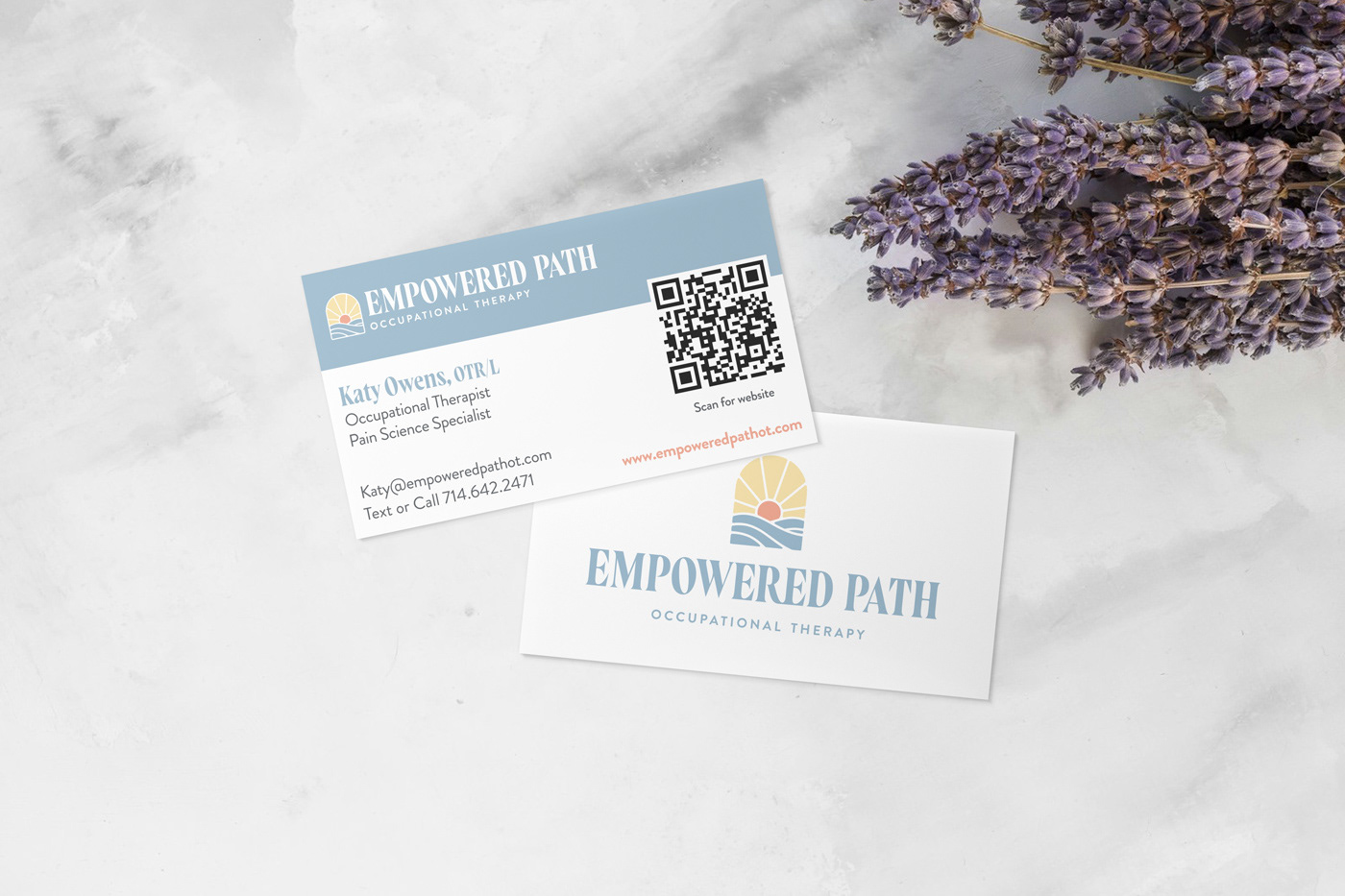 Empowered Path Occupational Therapy business card design on marble countertop