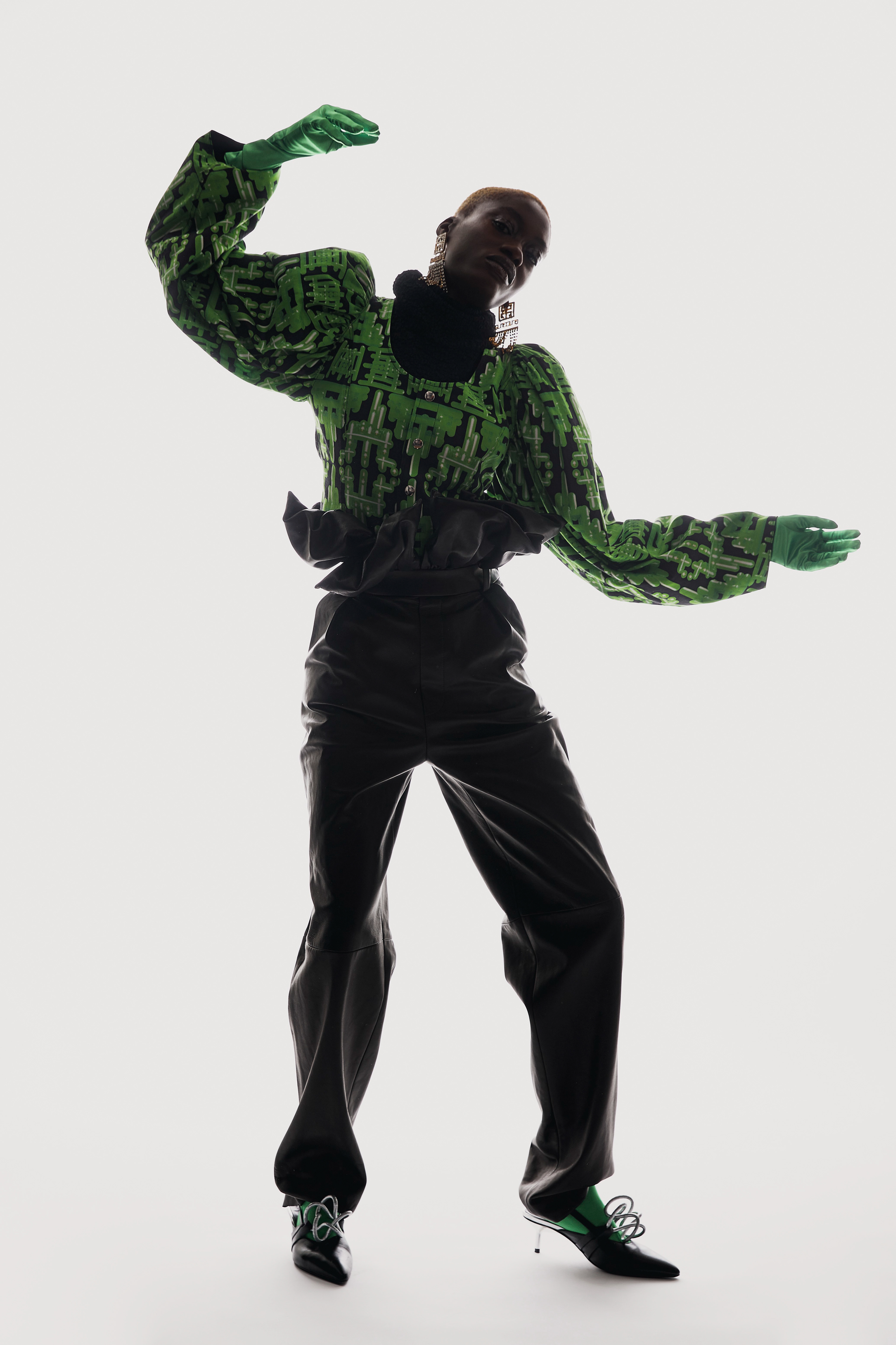 LETTER S - Photographer: Alizée Omaly / Stylist: Dorothée Evouna / Makeup Artist: Charlotte Le Balch / Hair Stylists: Yohanna Heurtault, Modjéré Diakite / Model: Mariame Ouattara / Garments: Jacket and shoes VICTORIA/TOMAS, turtleneck sweater and pants DIDIT HEDIPRASETYO, gloves MAD VINTAGE, tights FALKE, jewelry SHOUROUK / Typeface: Ball Pill designed by Benoît Bodhuin