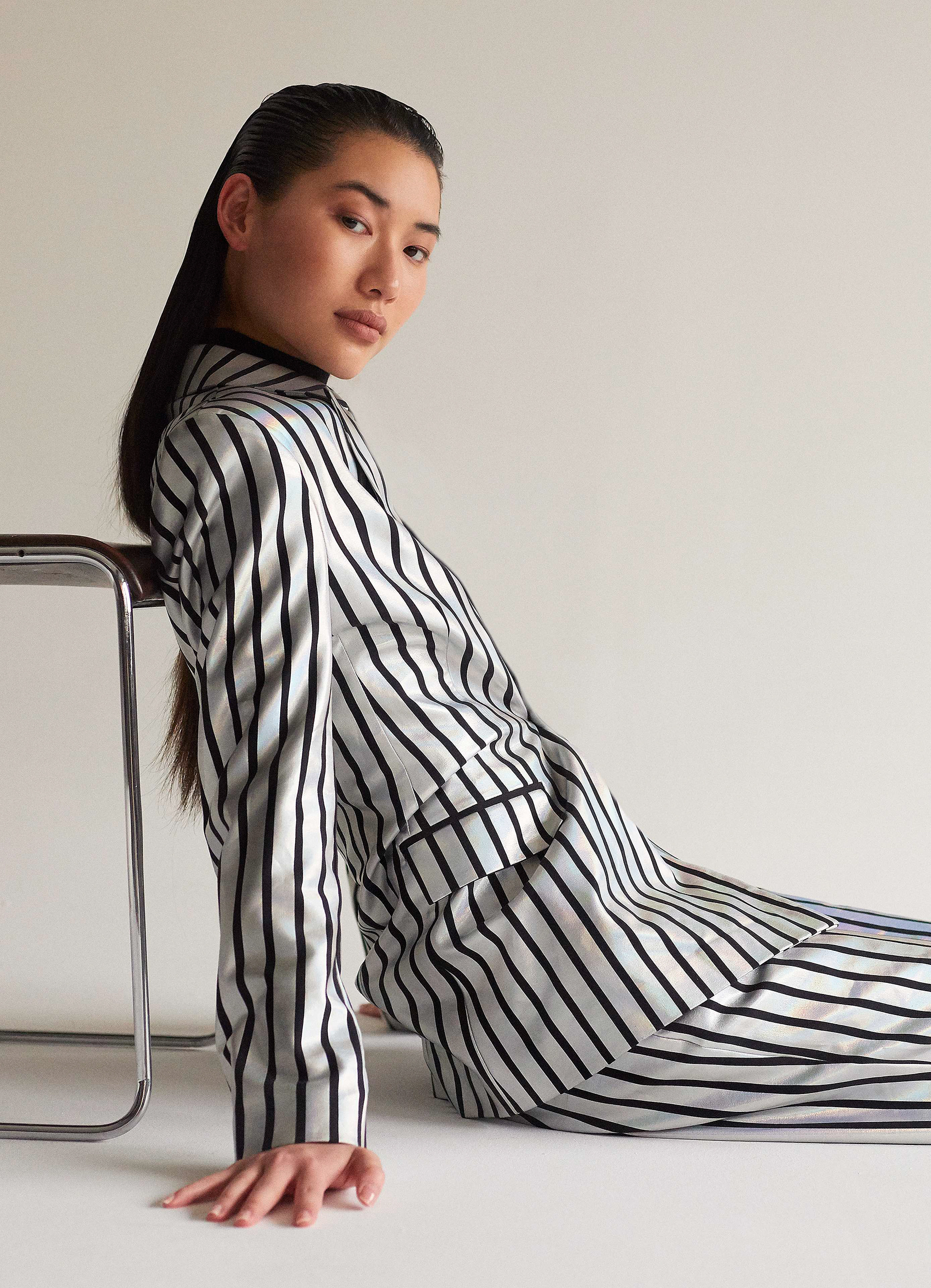 LETTER L - Photographer: Robbert Jacobs / Stylist: Dorothée Evouna / Makeup Artist: Charlotte Le Balch / Hair Stylists: Delphine Bonnet, Clément Billon / Model: Emeline Ruan / Garments: Jacket and pant STYLIST OWNED, tights FALKE, shoes AVELLANO / Typeface: GRTSK Mega Bkslnt designed by Ilya Naumoff & Benjamin Blaess
