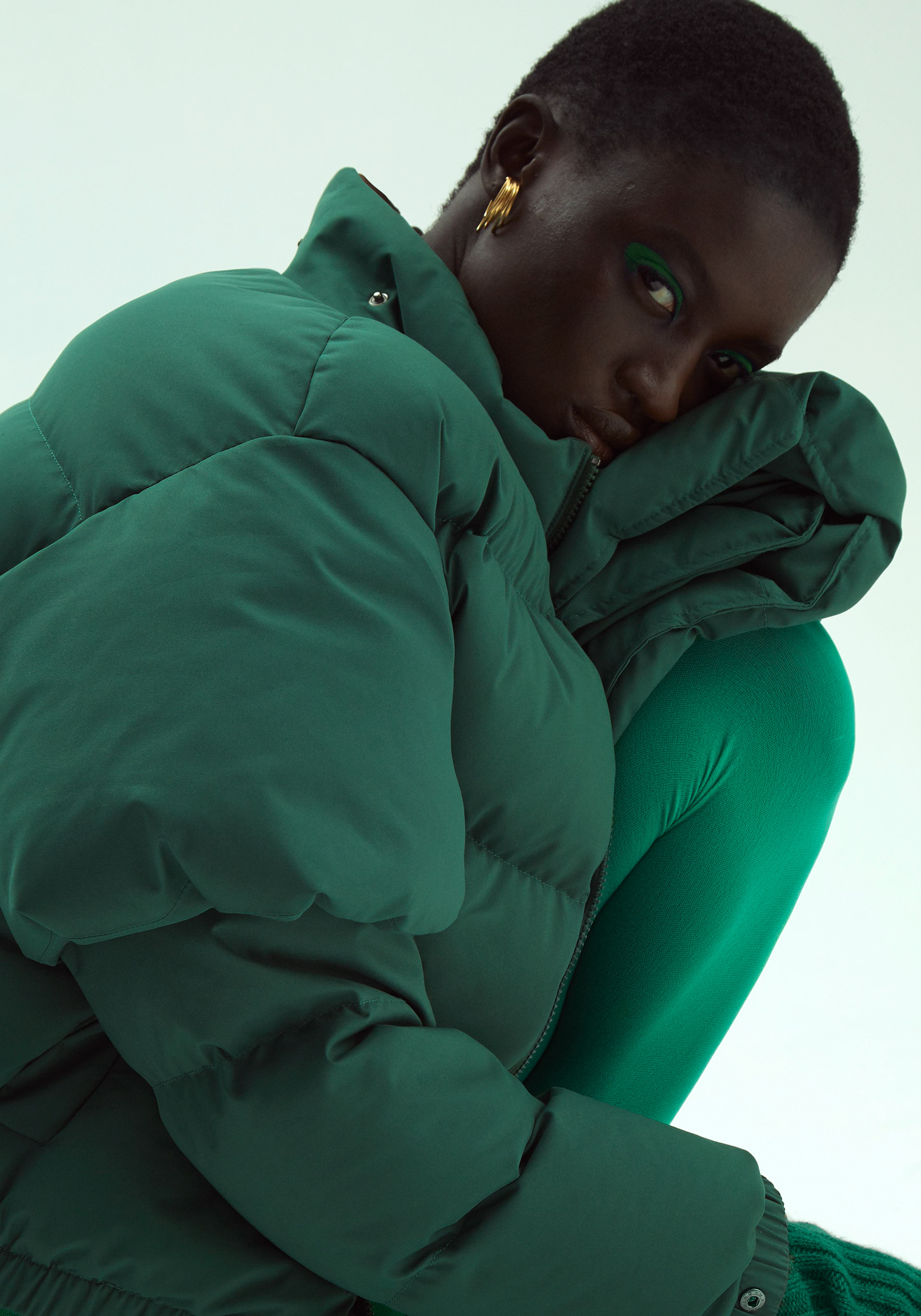 LETTER B - Photographer: Robbert Jacobs / Stylist: Maëva Mallier / Makeup Artist: Charlotte Le Balch / Hair Stylists: Delphine Bonnet / Model: Sokhna Cisse / Garments: Jacket DESFXXK, Body DEX MENS, mittens LINNEA LUND, shoes NOMASEI, tights FALKE, sunglasses DIOR / Typeface: Trois Mille designed by Marc Rouault