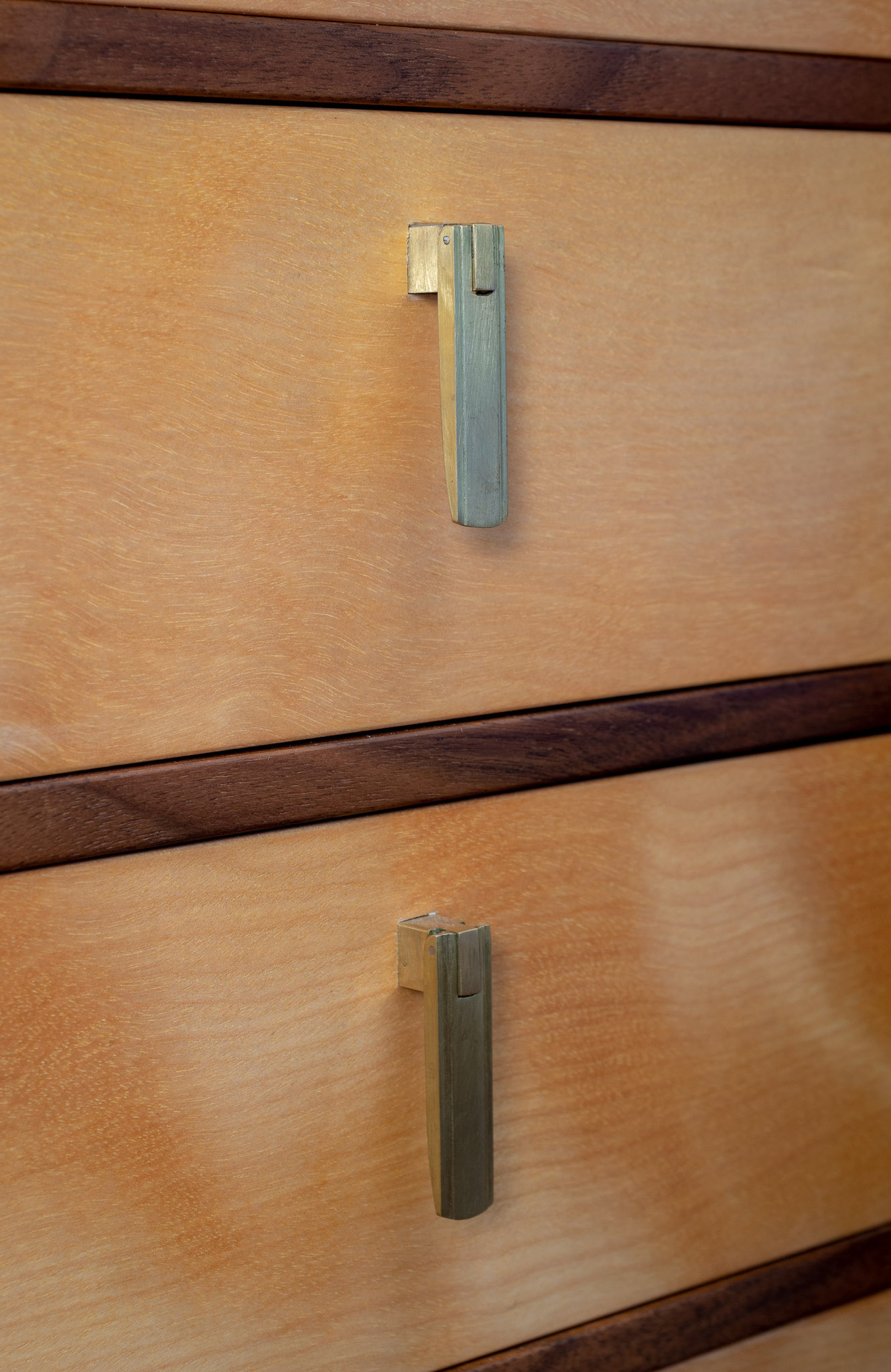 Handmade Pendant Pulls. The square post of the pull is slightly mortised into the drawer front to keep them from rotating and gouging the surface.
