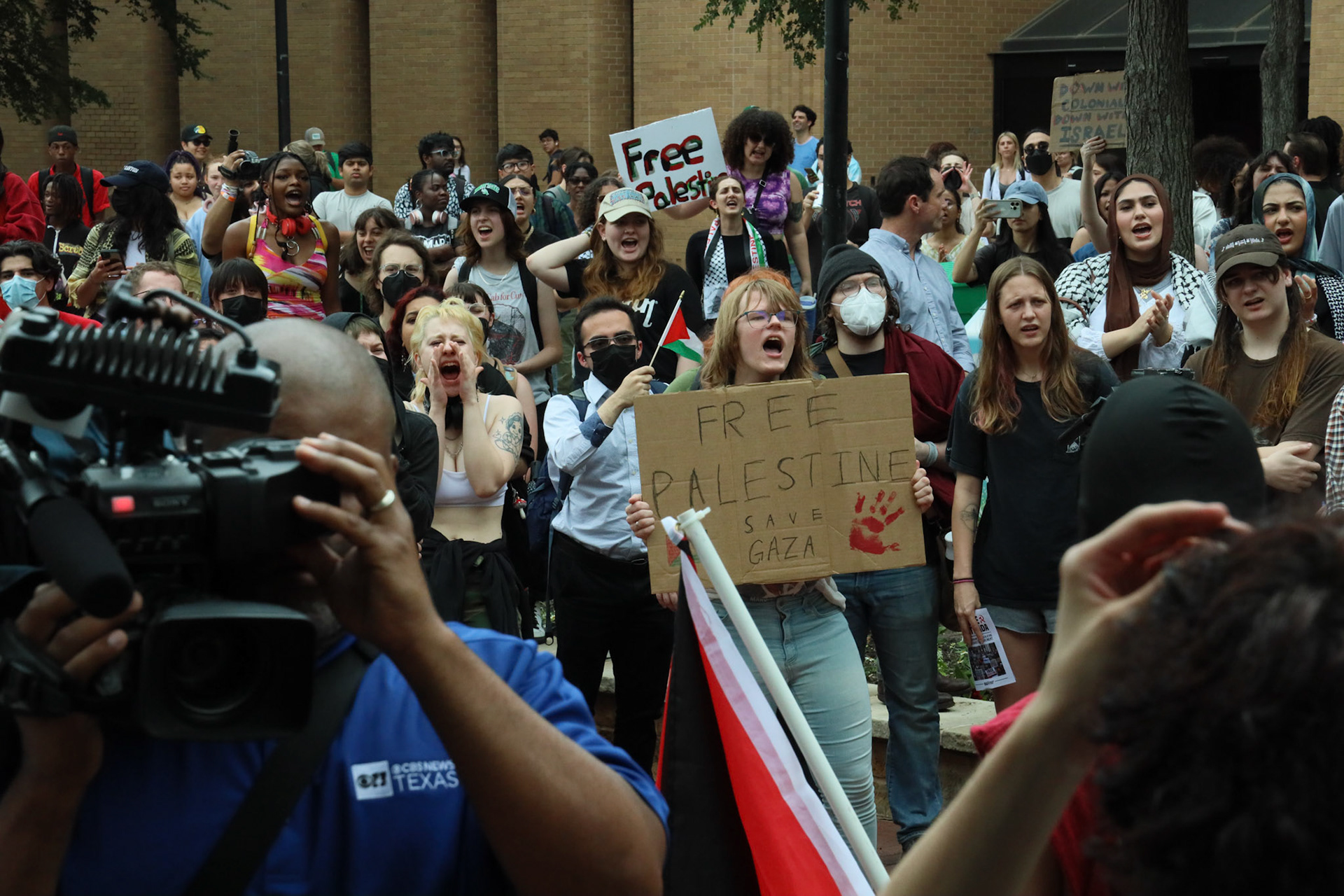 FACES OF PROTEST- Demonstrators, protesting the war in Gaza, fill the Willis Library Mall at the University of North Texas. “I came to today's event to show solidarity for Palestine and to speak about something that needs to be spoken about," Nadin said.“With the privilege I have in a still-standing university and as a graduate student, it is my right to speak forward.” By Alaina Jones