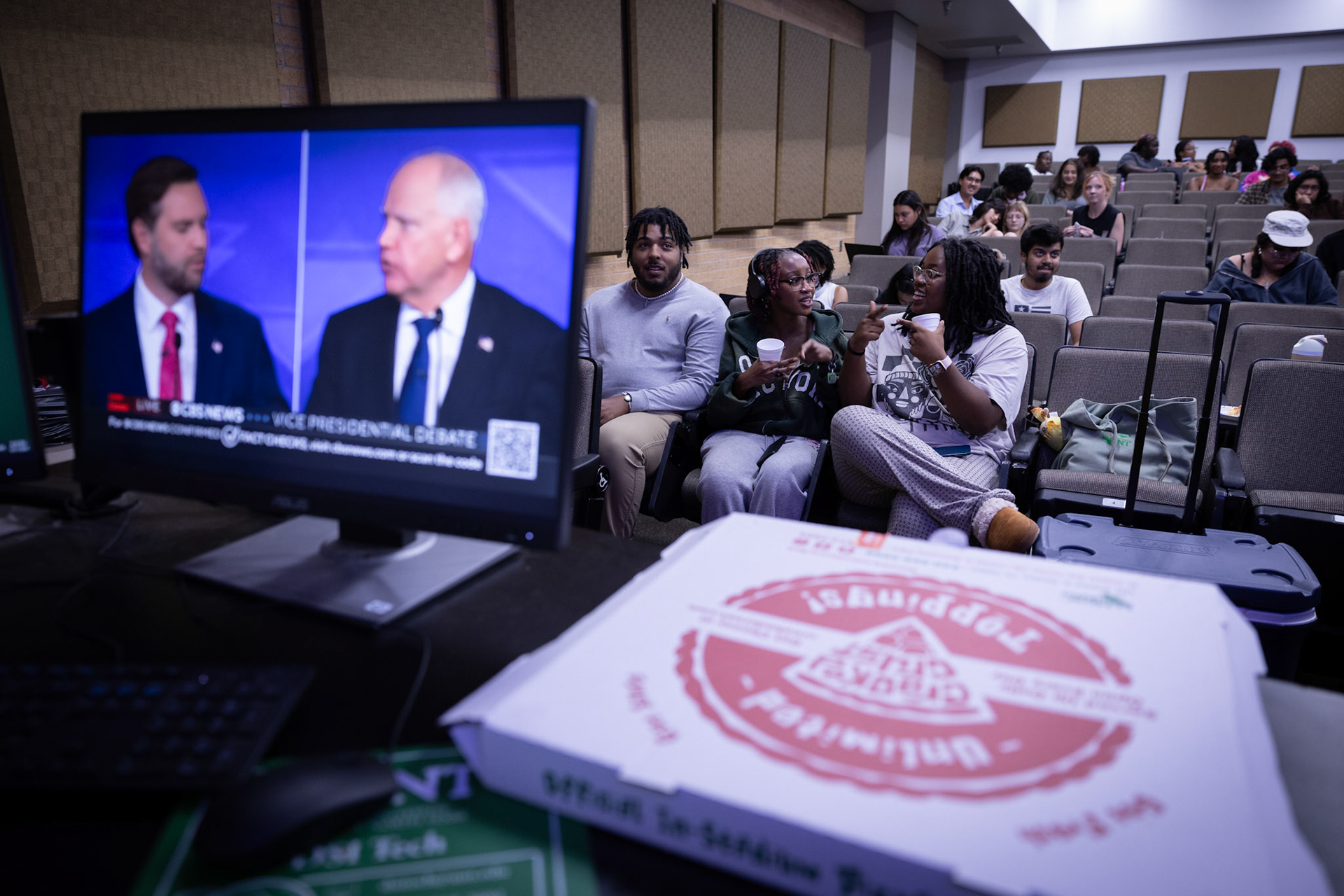 CROSSROADS- Senior Semaj Johnson, Freshman Sherry Kaluya and Senior Grace Kadia watch the 2024 Vice President Debate on Oct. 1, 2024 at the UNT Speech and Debate team viewing party. "As much as I enjoy the Presidential Debate, the Vice Presidential Debate deserves as much attention," Kadia said. By Alaina Jones