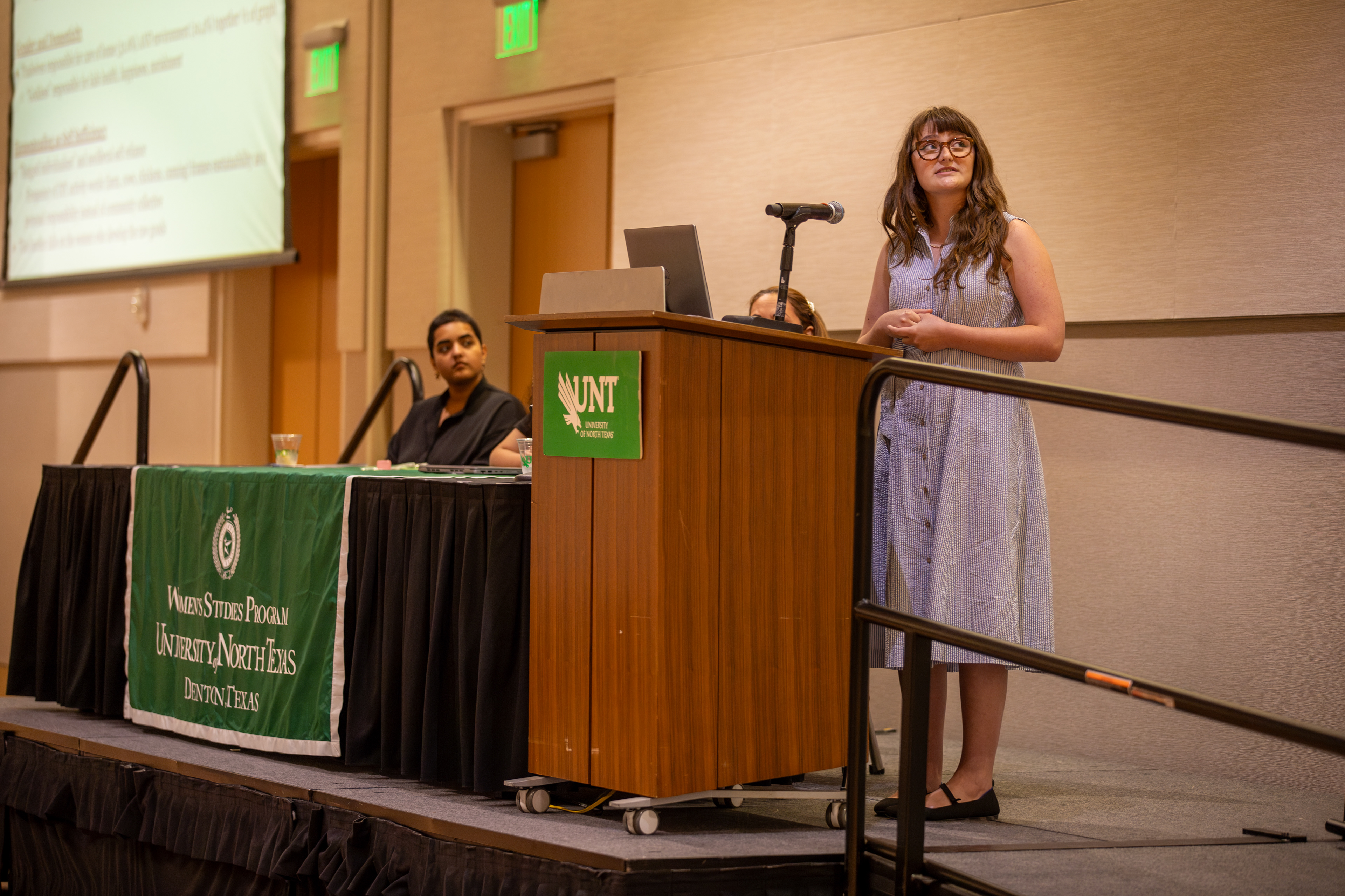 TRAD- White presents her research project, titled “Back to the Land or Back to the Kitchen: Neo-Homesteading and the Trad Wife Movement,” in the UNT General Academic Building on April 21, 2025. She was inspired by the recent rise of social media influencers portraying themselves as “traditional housewives.” “I became fascinated by how curated these lifestyles are,” White said. “A lot of these women have hired help for homeschooling and homesteading, but that part is rarely shown.” Her project aims to examine and challenge the authenticity of these portrayals. Photo by Alaina Jones