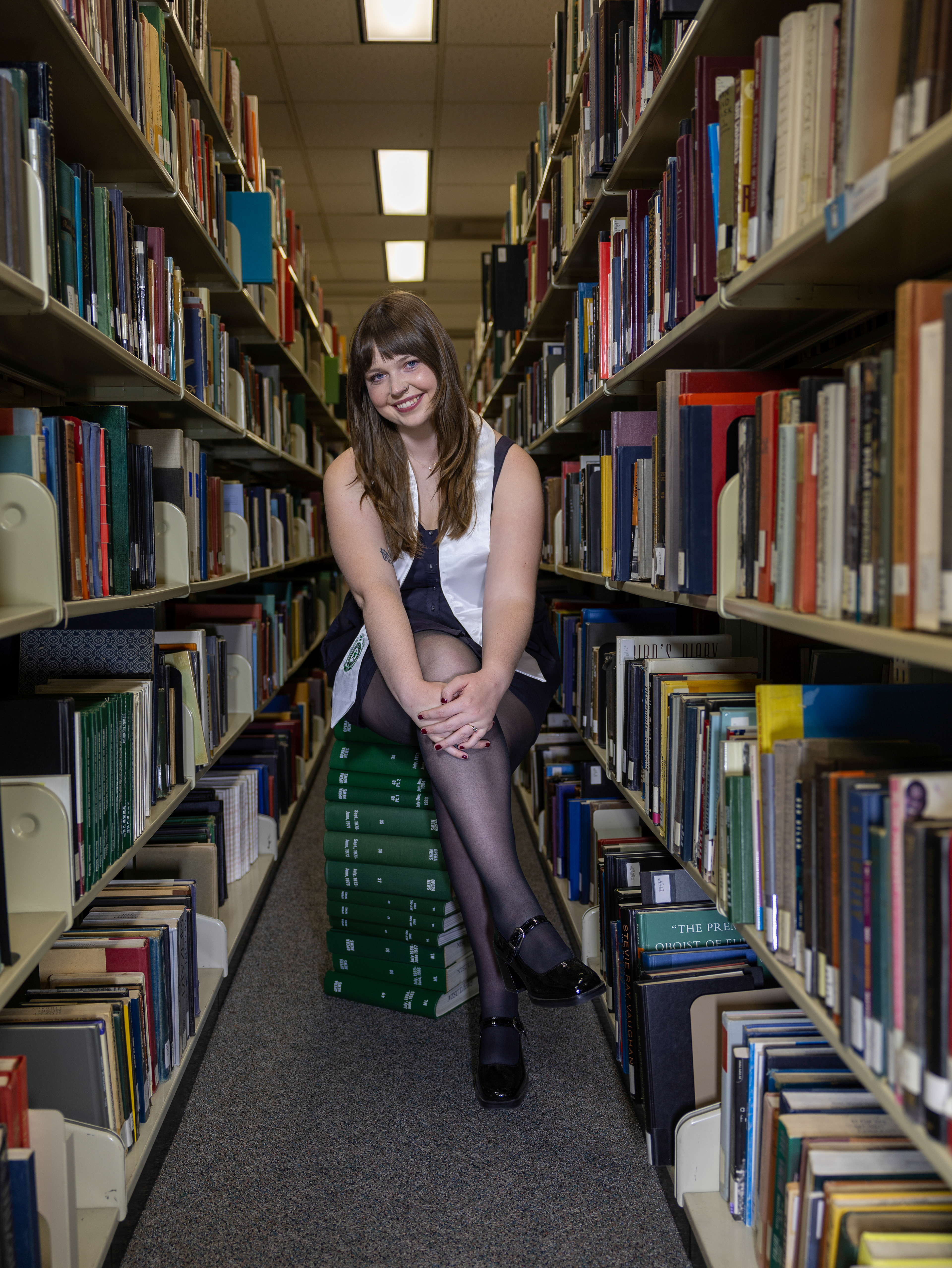 UNT Senior Ella Shumaker poses for a portrait on April 11, 2025, outside of the Administration Building on the UNT Denton Campus. “I just can't believe I am almost finished. I have been working so hard for the past four years and I walk the stage on Saturday,” Shumaker said. Photo by Alaina Jones