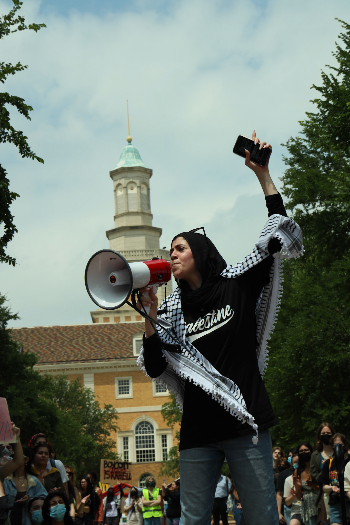 VOICES IN MOTION- Students at universities across the U.S. took part in simultaneous "class walkouts" and demonstrations against the war in Gaza on April 30, 2024.  With UNT's Hurley Administration building as a backdrop, UNT Palestine Solidarity Committee (PSC) member, Malak, who preferred to share only her first name, led the chant, "Free, free Palestine!"  By Alaina Jones