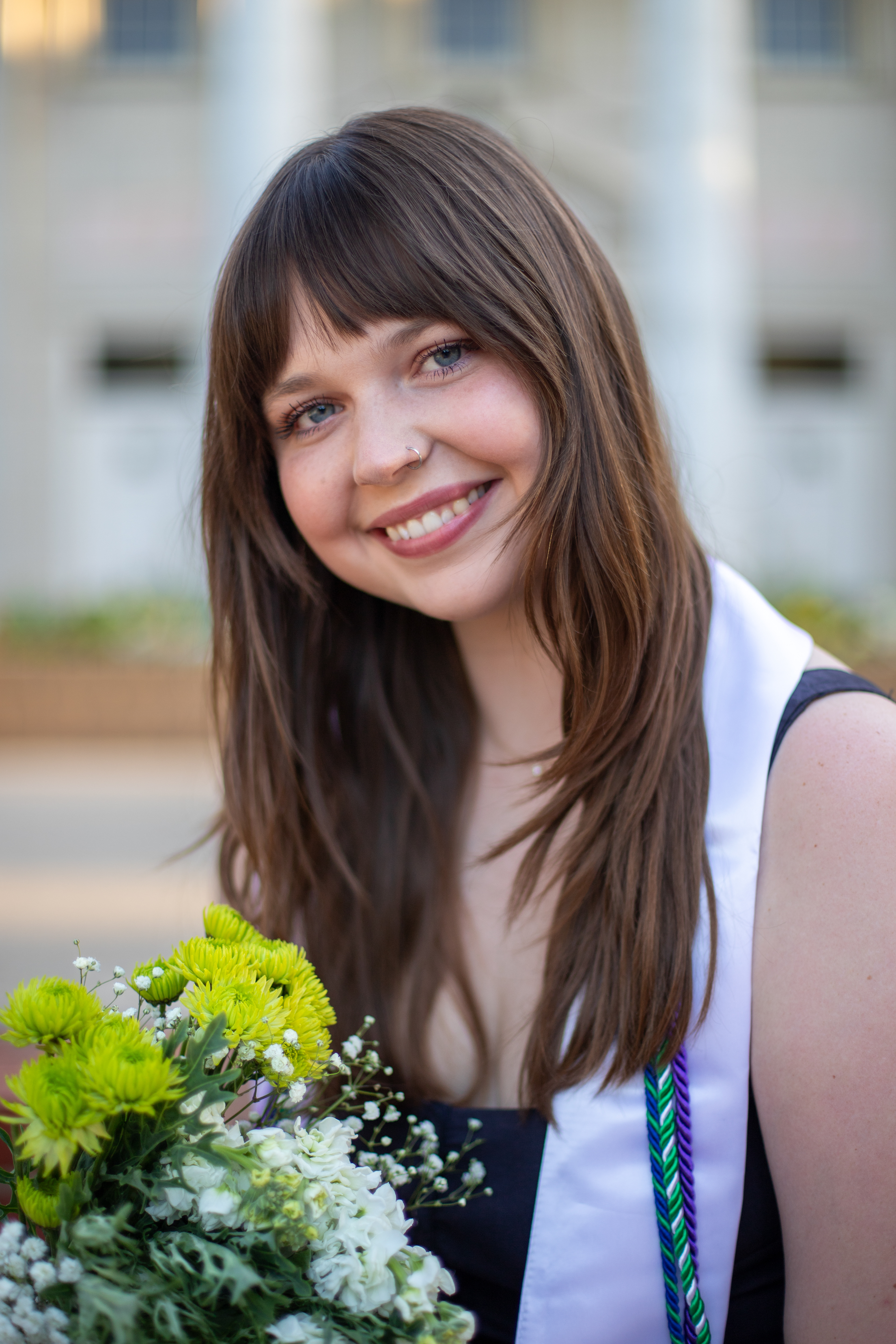 UNT Senior Ella Shumaker poses for a portrait on April 11, 2025, at the Willis Library on the UNT Denton Campus. Shumaker is the President of the UNT Psychology club on campus. Photo by Alaina Jones