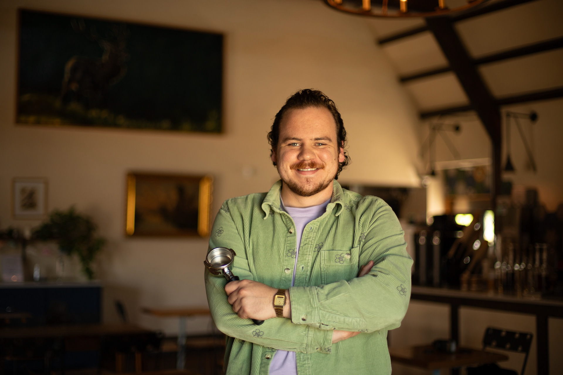 Manager at Kimzey’s Coffee in Argyle, Connor Patterson, smiles for a photo during his shift on April 15, 2025. Patterson began working at Kimzey’s Coffee four years ago and was recently promoted to manager after finishing bachelors degree at UNT. Photo by Alaina Jones