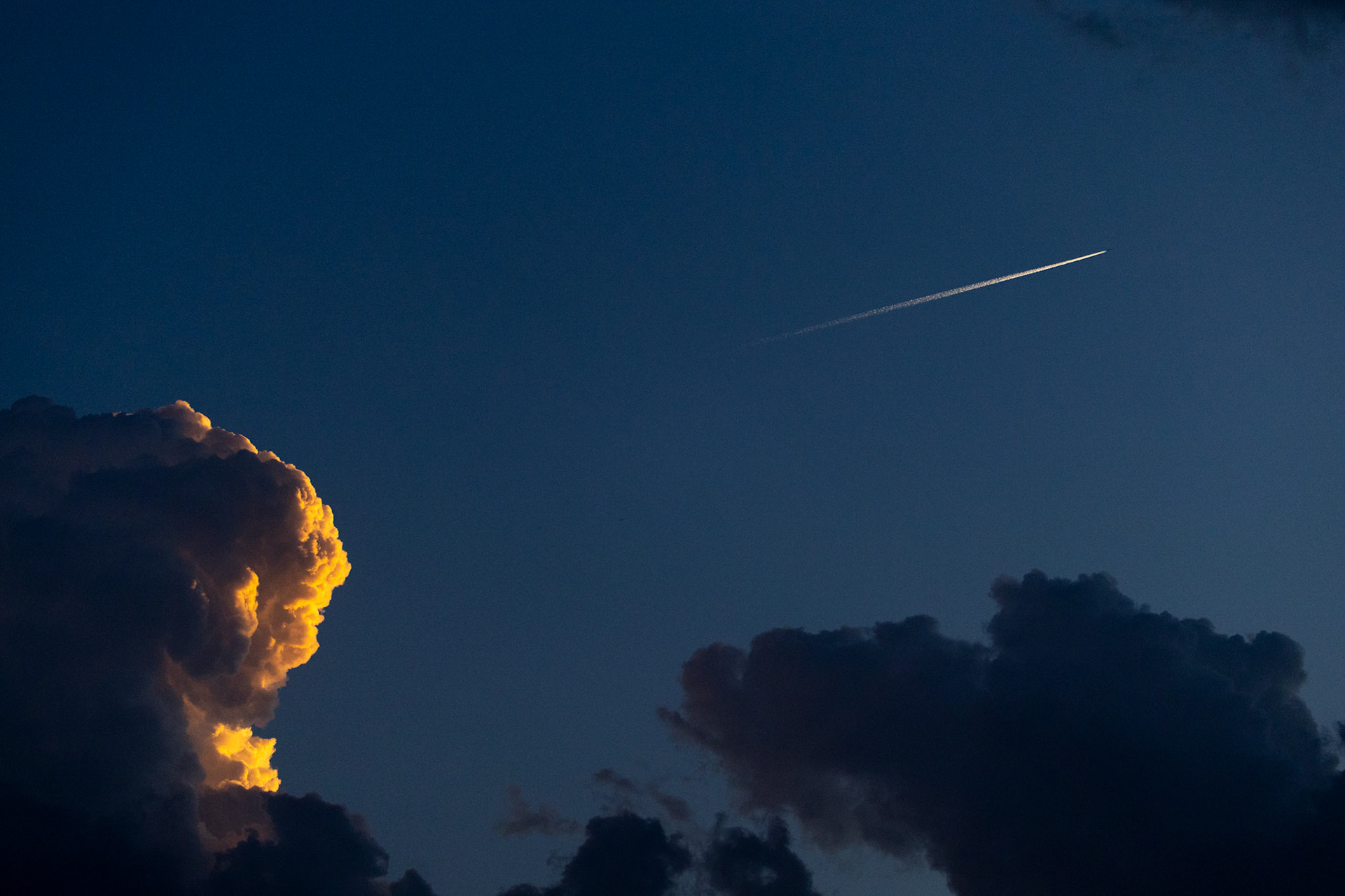 SKYBOUND- Above the Denton US Aviation Academy March 25, 2025, a jet paints a line of contrails. The contrails are created from the jet engines exhaust water vapor freezing at the high altitude.  Photo by Alaina Jones 