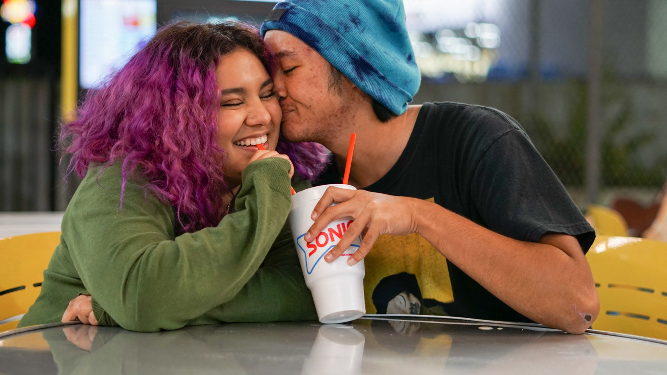 Lili Gonzales and Justin Lee share a kiss at Sonic in Huntsville in August 2021. Photo by Alaina Jones