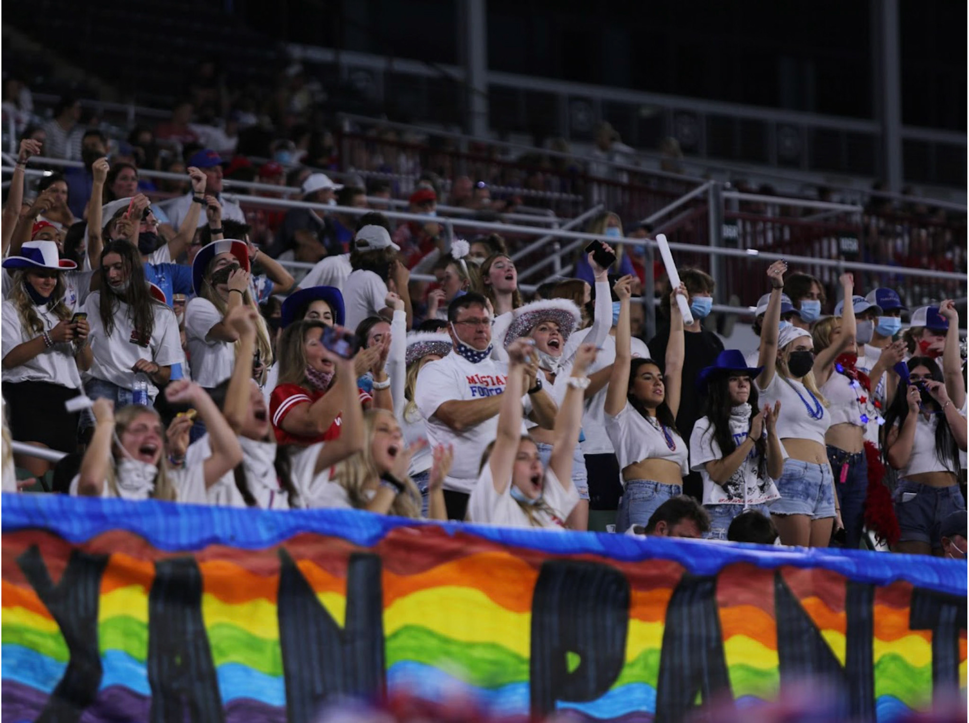 UNDER THE LIGHTS- The Grapevine High School’s crowd screams along with the Spirit Rustlers powerful chant, during the intense Battle of the Red Rail rivalry game held on Aug. 27, 2021 against Colleyville Heritage at Mustang-Panther Stadium. By Alaina Jones