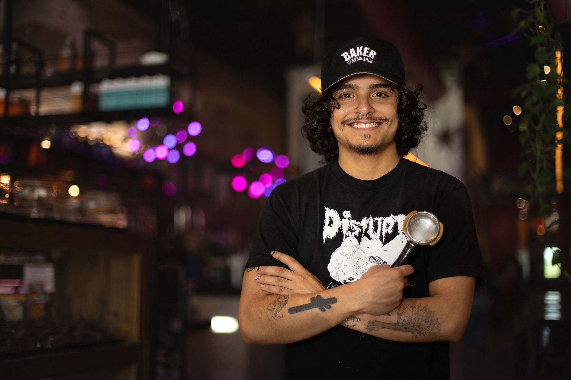 During his closing shift on April 15, 2025 at Jupiter House Barista, Tim Bernal, poses for a photo. “I have worked here for over two years,” Bernal said. “I love the community here. I love having the same group of customers, and being at the center of it all,” Bernal said. Photo by Alaina Jones