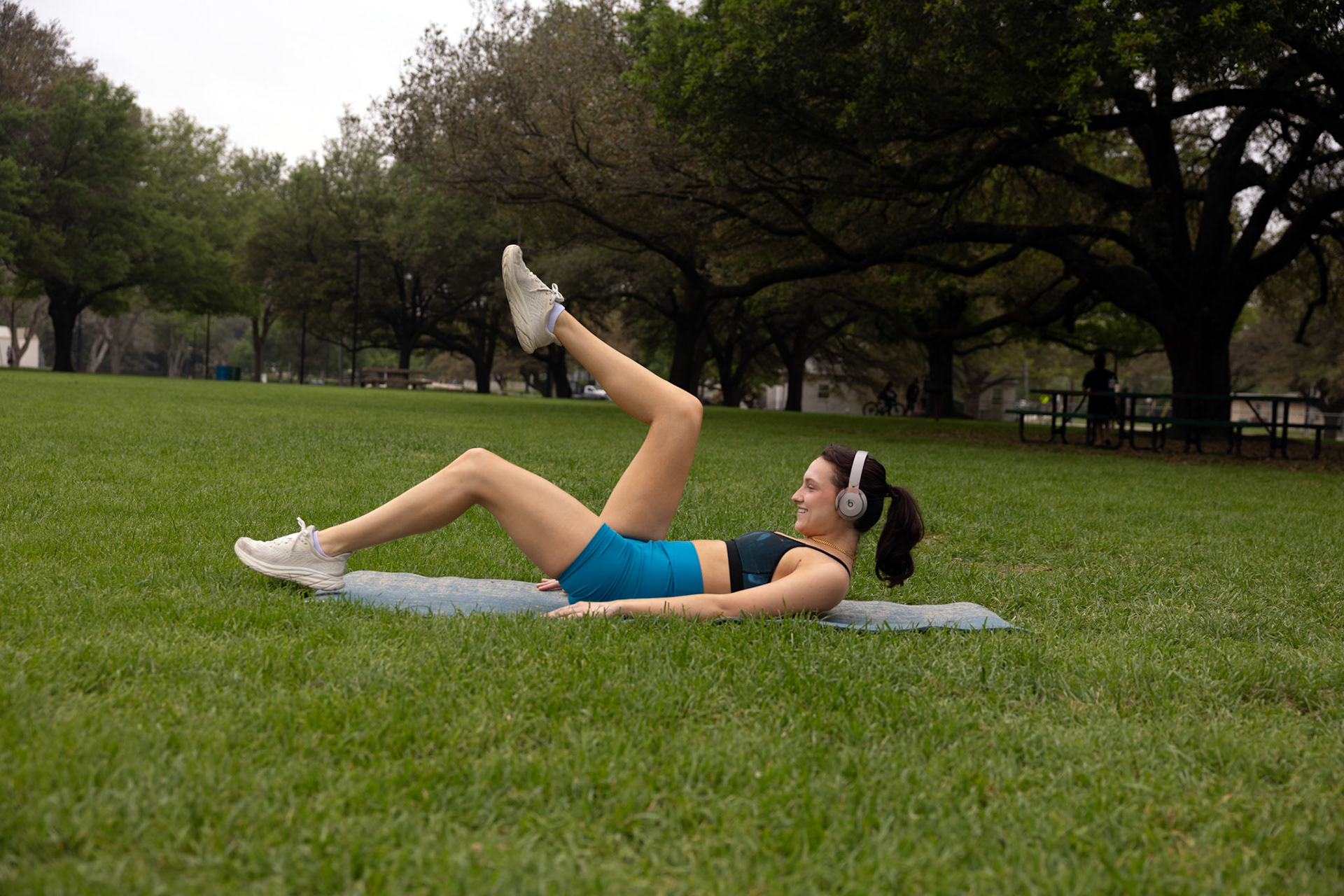 PROPER EXERCISE- Kalie Reed, 23, a dedicated and disciplined individual routinely begins her day with her favorite pilates workout at Quakertown Park on April 1, 2024. Photo by Alaina Jones