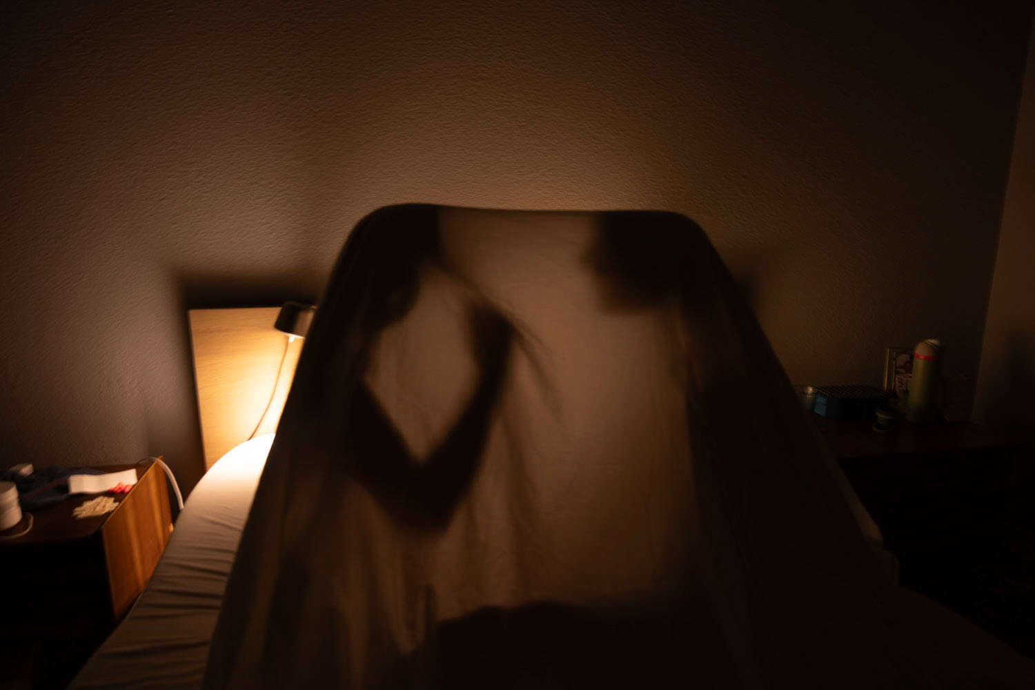 YOUTHFUL JOY- A couple plays together under a sheet on December 15, 2024, sharing childlike fun and innocence. Photo by Alaina Jones