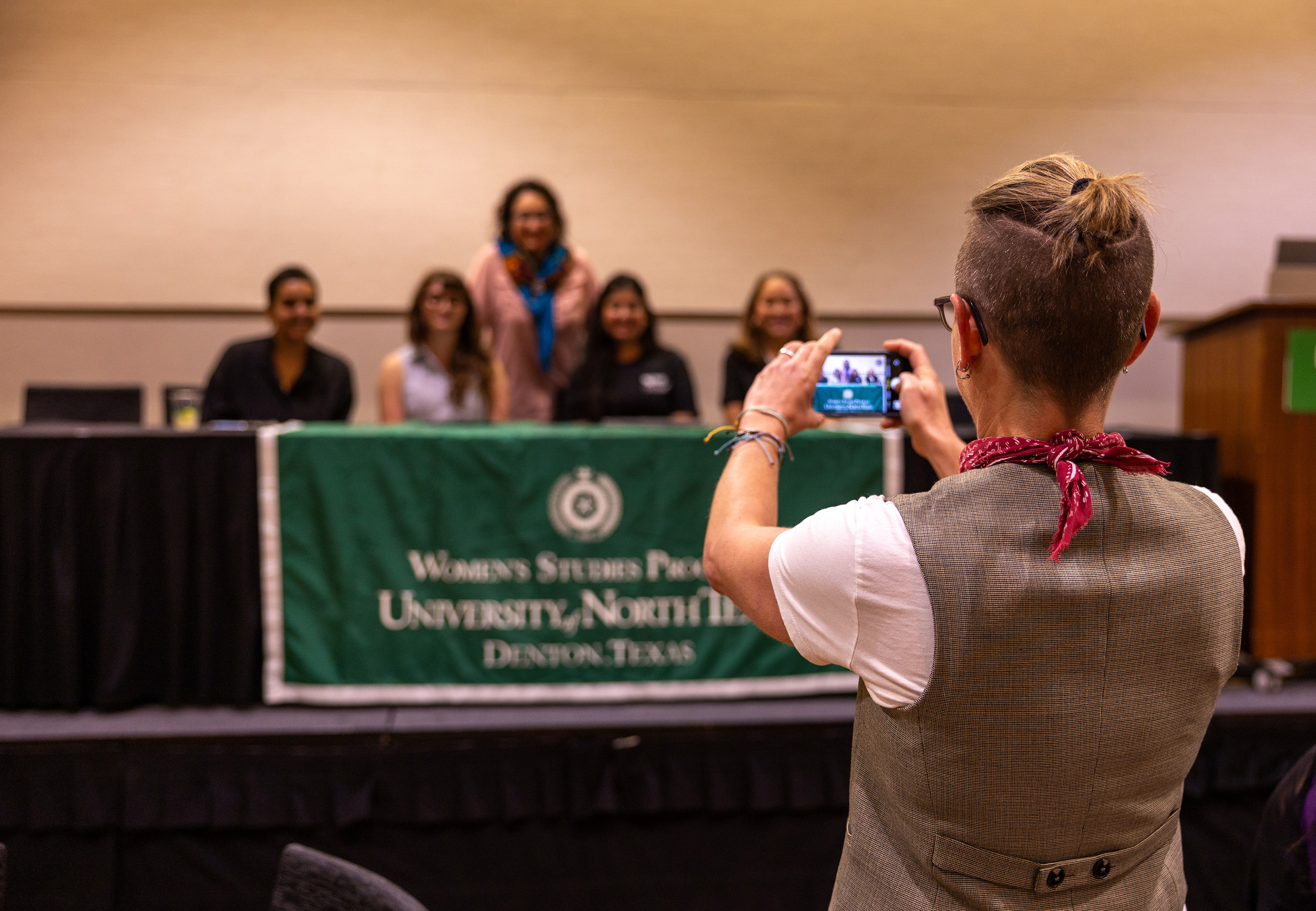 DENTON, TX April 21, 2025 AWARD- Jara Carrington, UNT Women’s and Gender Studies advisory board professor, takes a photo of Rose Bhaskar, Isabella (Bella) White, Kina Alizai and Valarie Gonzalez at the April 21, 2025 WAGST Research Symposium and Recognition Ceremony. White and her peer, Sezen Tunali, were recognized as Outstanding Students. The award was presented by UNT Professor Ozlem Altiok, Ph.D., in recognition of the students’ academic contributions and their commitment to critically examining stereotypes surrounding gender, ethnicity, race and sexuality on a global scale. Photo by Alaina Jones