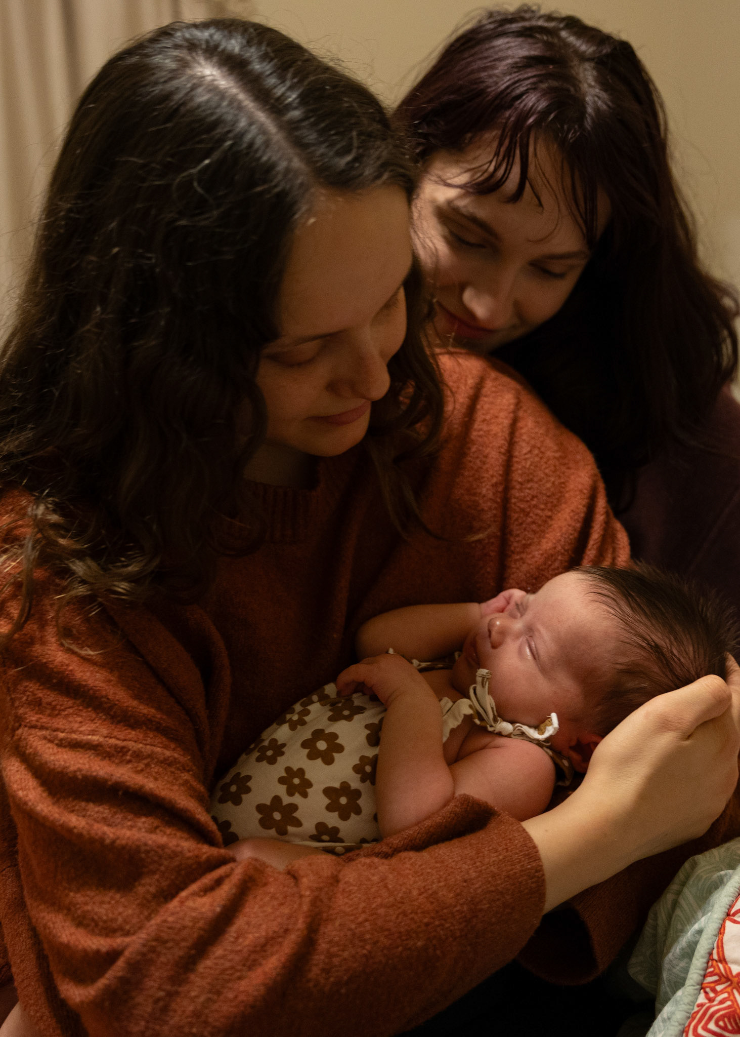 COMFORT- Sisters Kalie Reed and Nikki Pino hold Nikki's first born child, Emory, on Feb. 27, 2024 as she cries in an attempt to comfort her. Photo by Alaina Jones