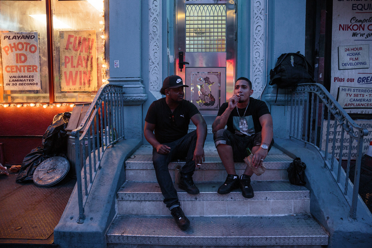 Anthony and Orlando, longtime residents of Washington Heights, sit on Amsterdam Avenue.