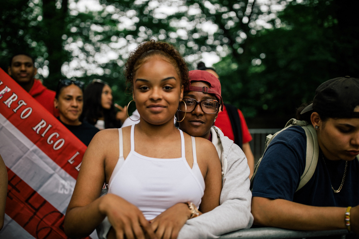 Two women stand for a portrait at Fifth Avenue and 74th Street.