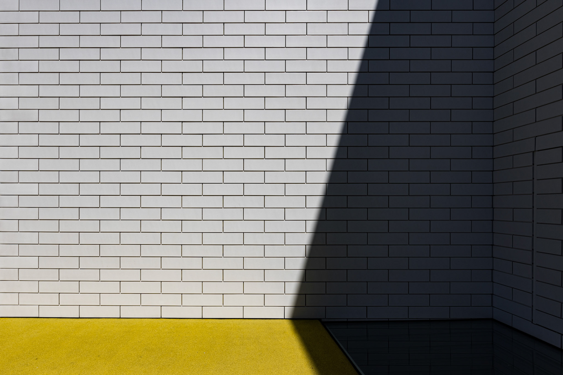 Afternoon shadows at Lego House.