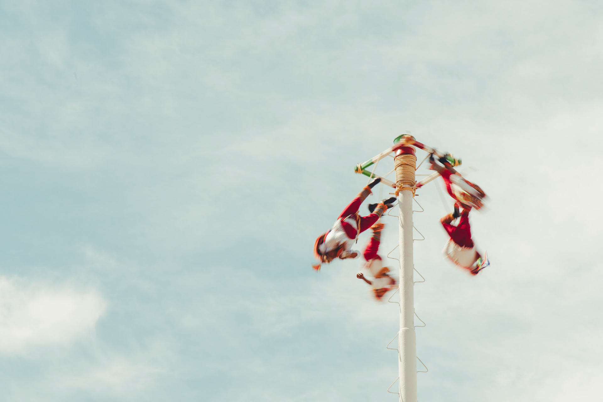 Suspended in a dance with gravity, the Papantla Flyers soar above Puerto Vallarta in an awe-inspiring display of tradition and skill.