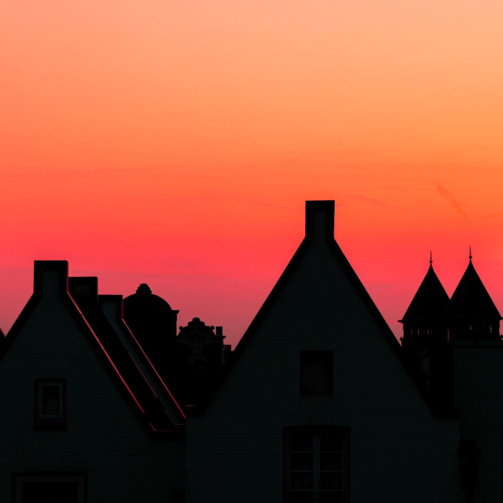 Silhouettes of Amsterdam’s infamous canal houses against a mesmerizing sunset.