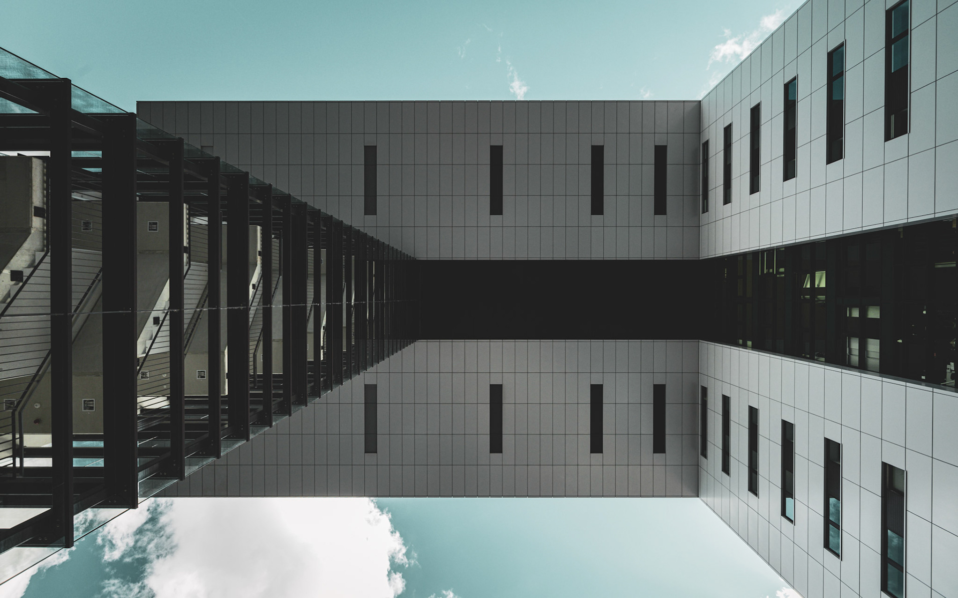 A skyward perspective beneath the Kranhäuser in Köln.