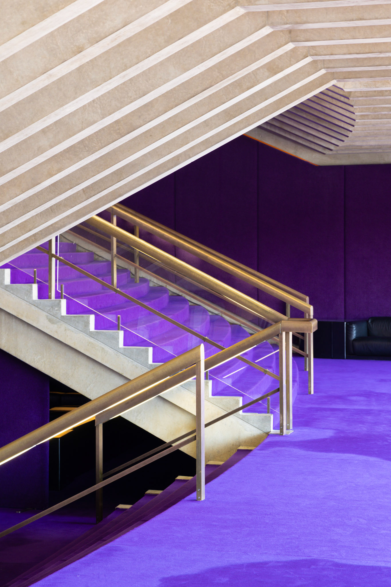 The vibrant purple carpet of the iconic Sydney Opera House serves as both a striking detail and a subtle reminder of the ever-changing stories it hosts. Each step taken across this surface is a reflection of the fleeting yet powerful moments that unfold within its walls.