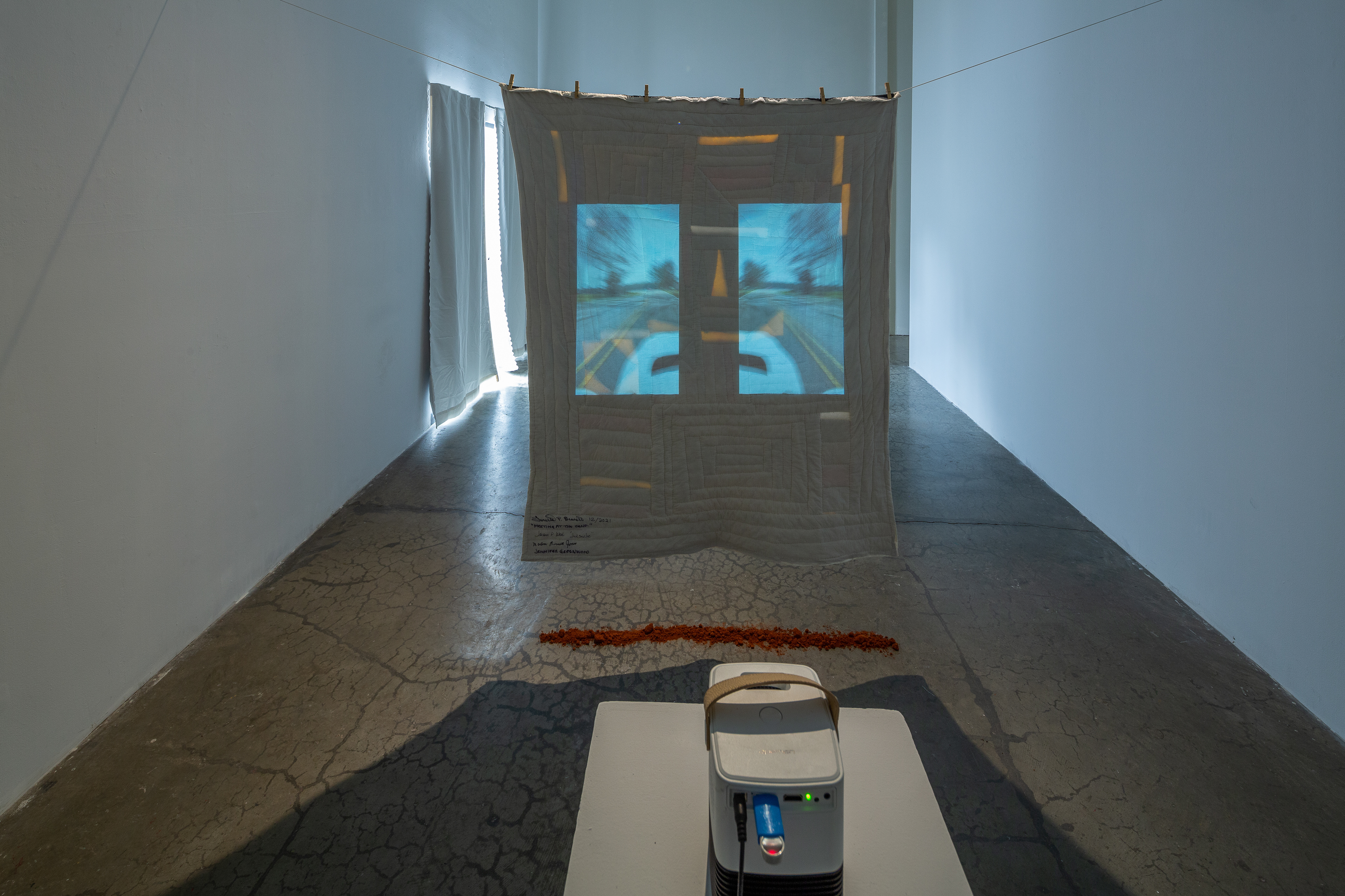 Meeting at the Bend, 2022, textile, Alabama Red Clay, projection, dimensions variable