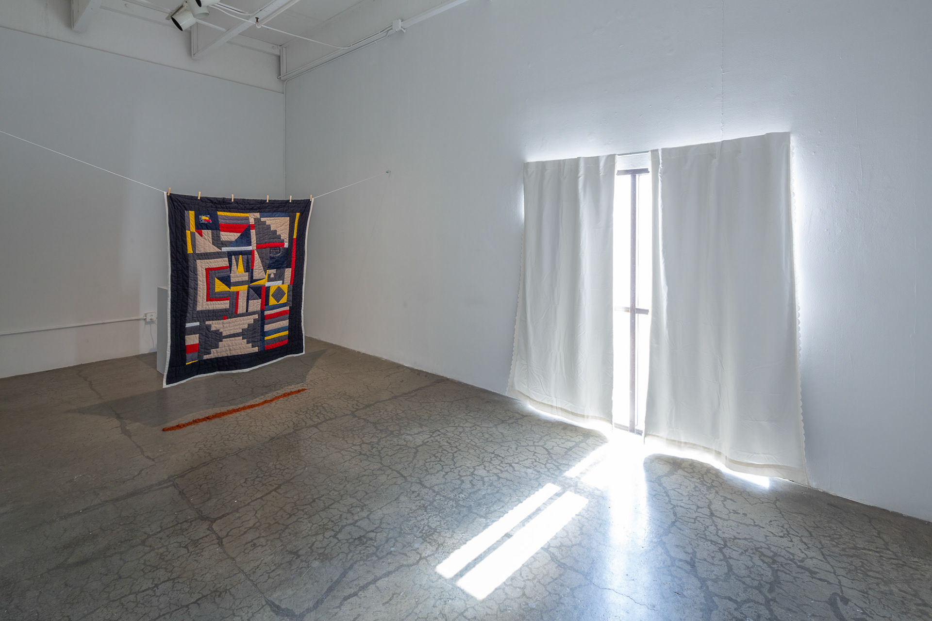 Meeting at the Bend, 2022, textile, Alabama Red Clay, projection, dimensions variable