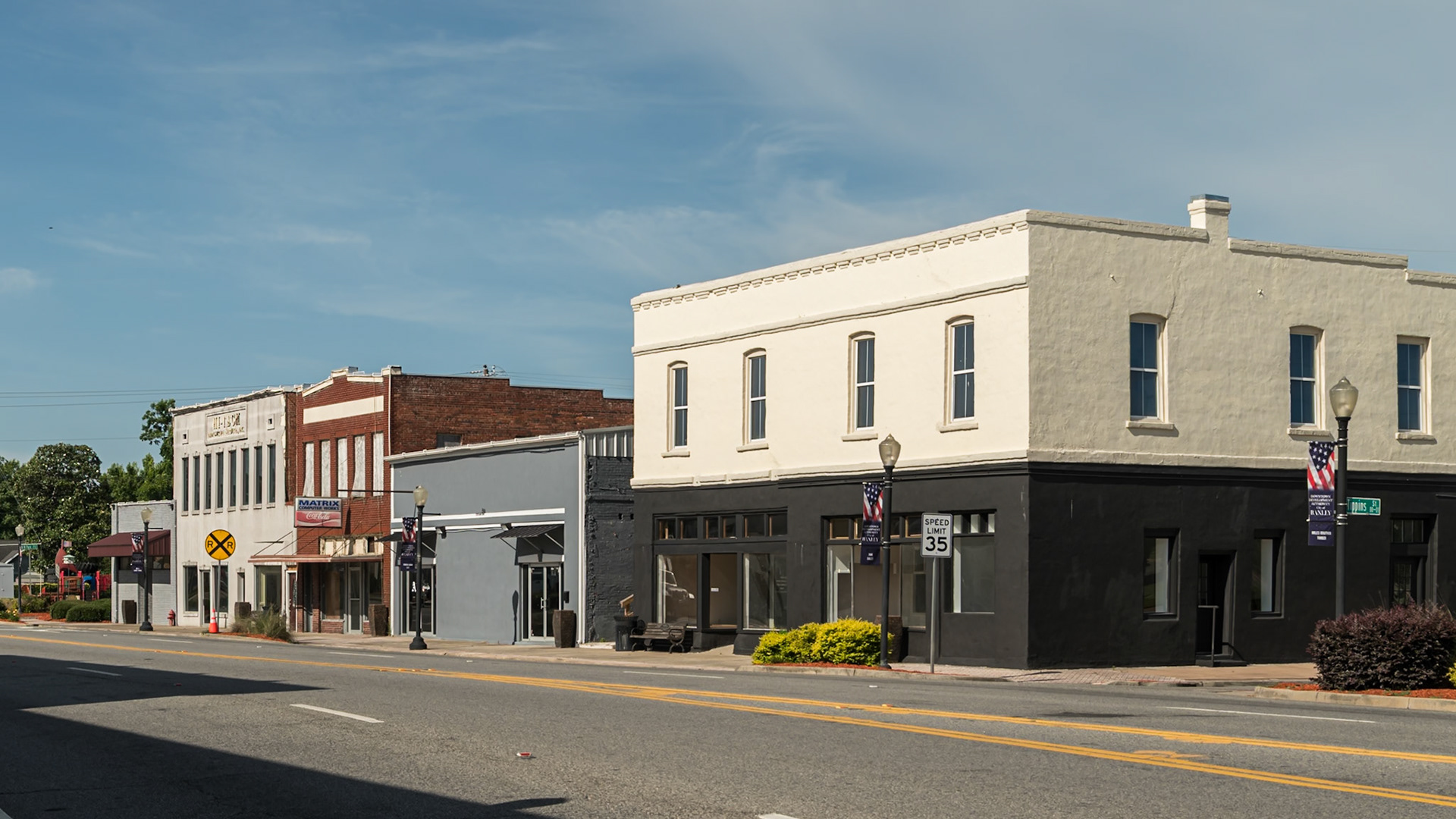 A row of commercial buildings along South Main Street in downtown Baxley, in June 2024
