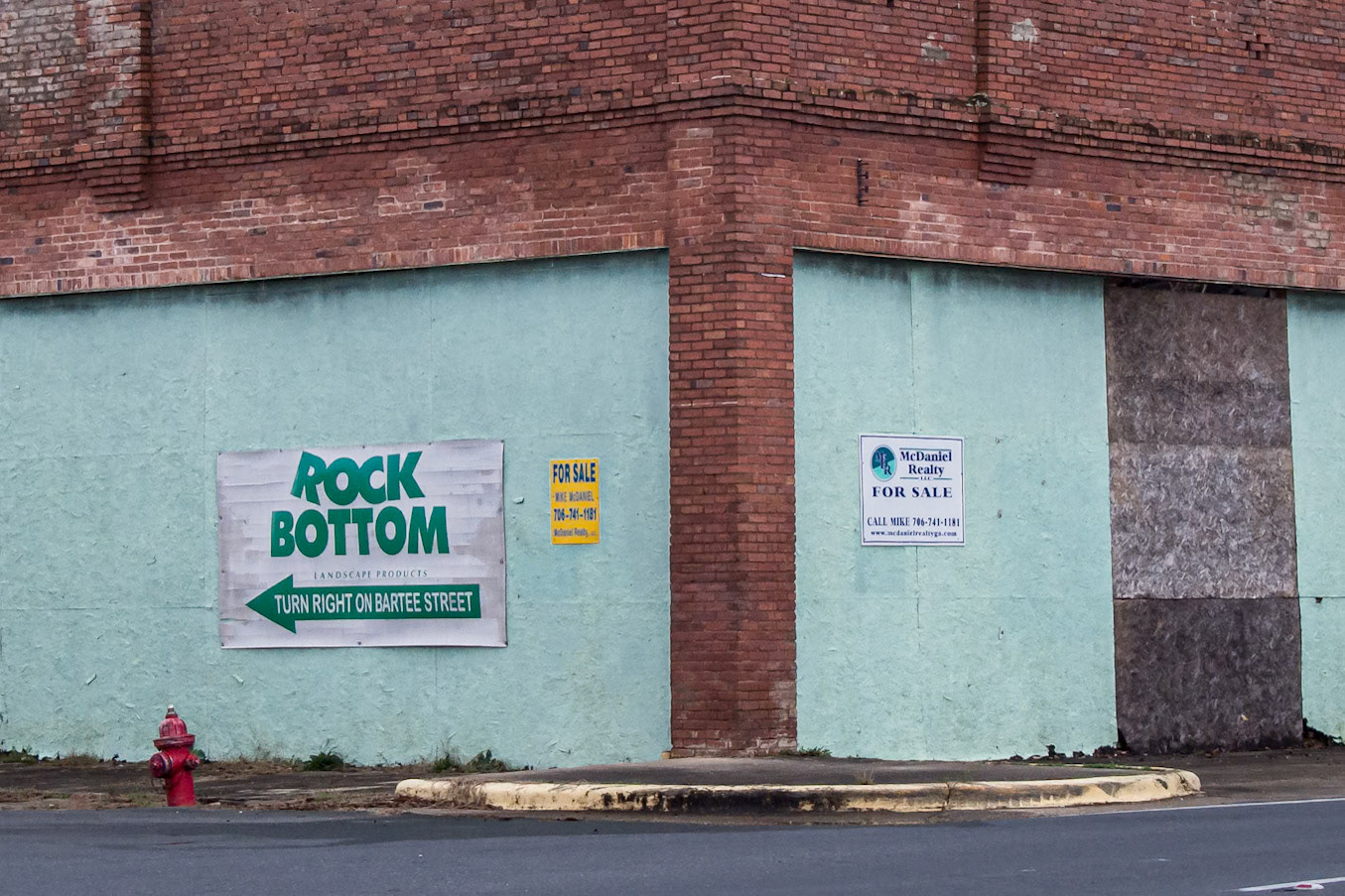 The turquoise-painted Rock Bottom building at a downtown corner in Woodbury, Georgia, in December 2015