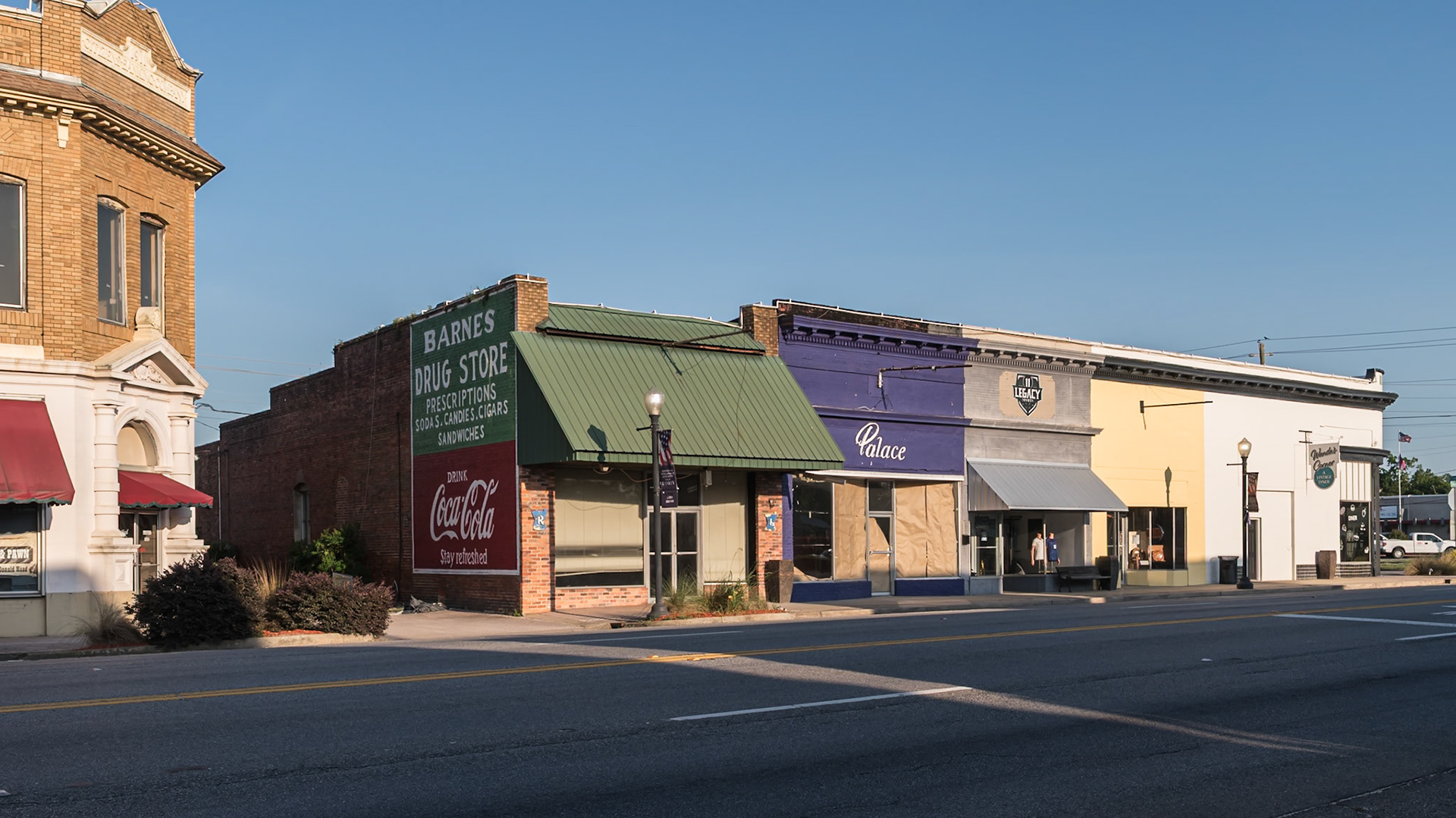 The former Barnes Drug Store and neighboring commercial storefronts in downtown Baxley, in June 2024