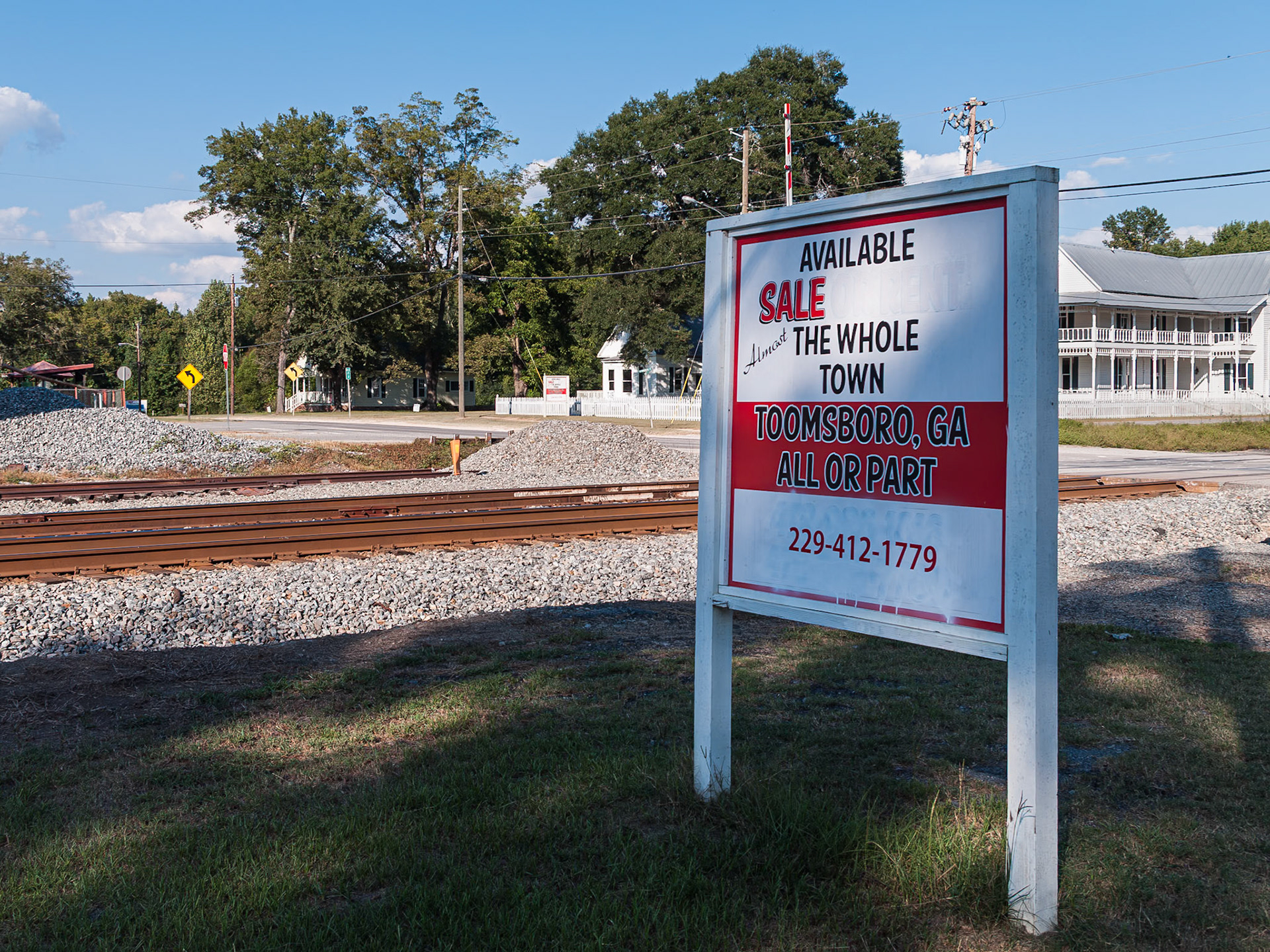 A sign advertising “Almost the Whole Town” for sale in Toomsboro, Georgia, photographed in September 2013