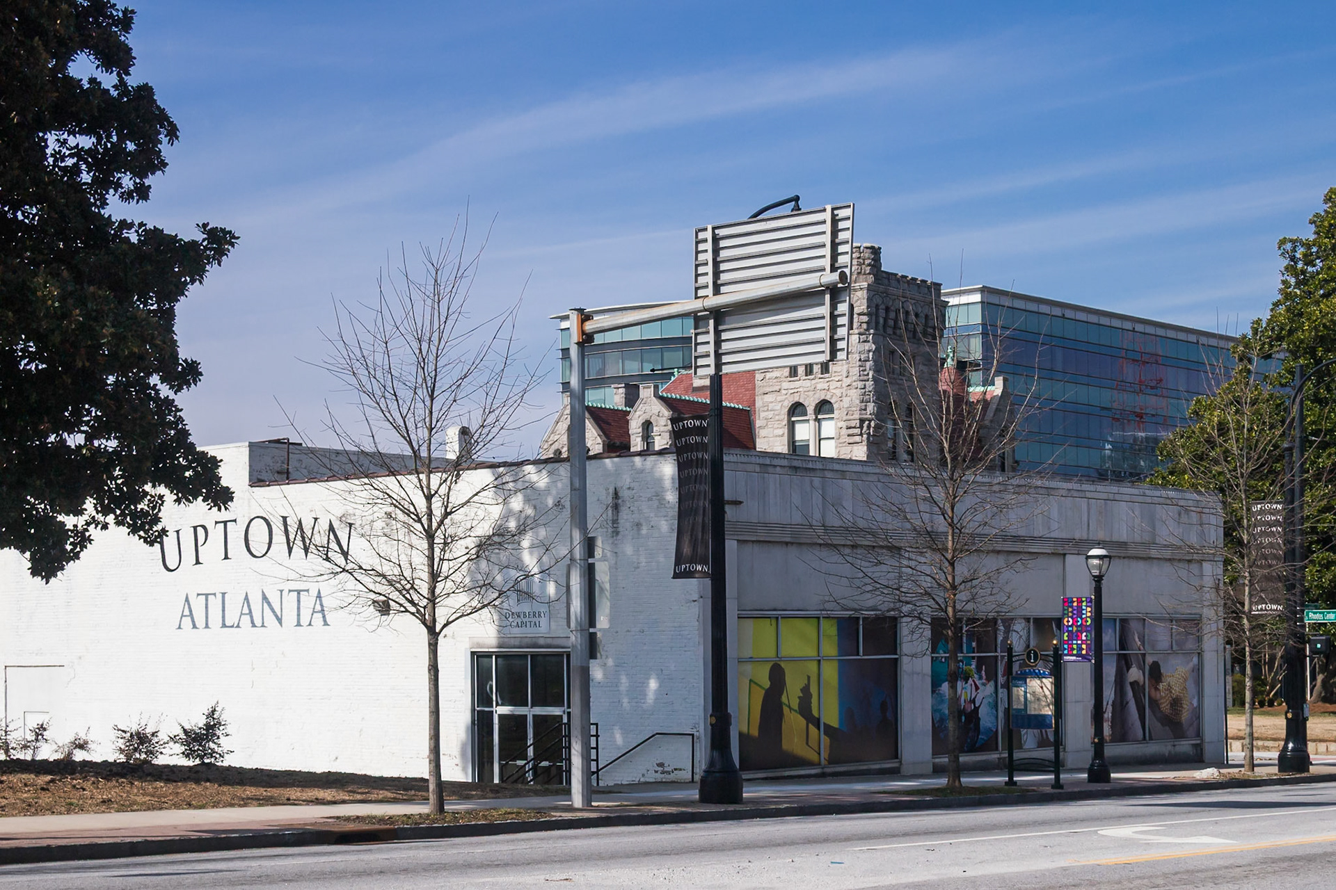 Rhodes Center South, the surviving portion of Atlanta's first strip shopping center, along Peachtree Street in Midtown Atlanta. “Uptown Atlanta” is displayed prominently across the façade