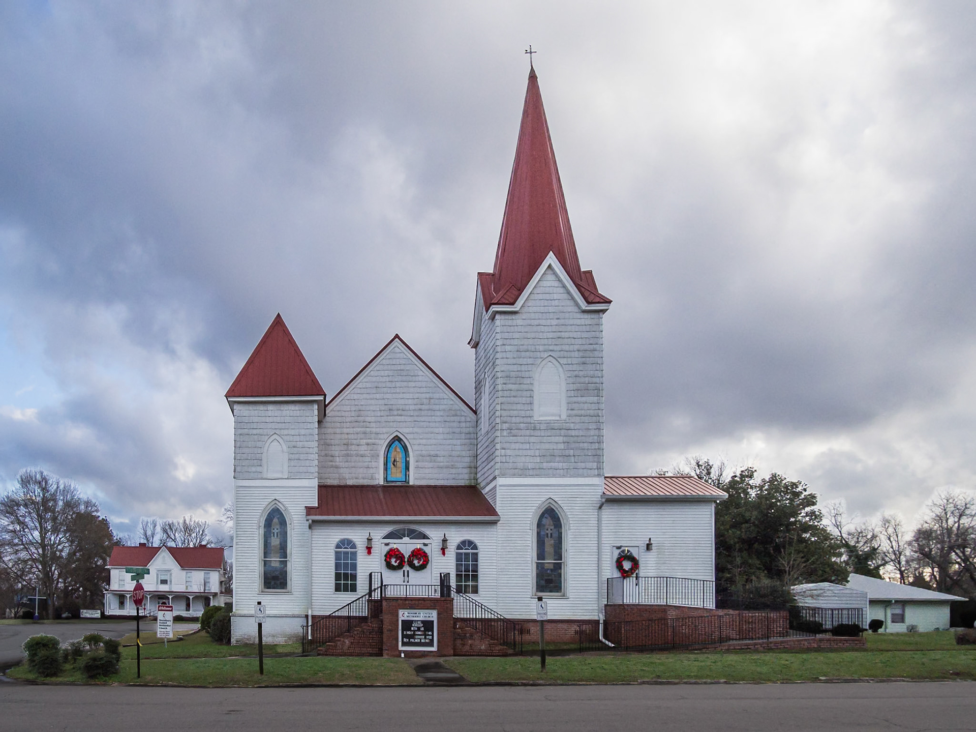 Wood United Methodist Church with red metal roofs and steeples in Woodbury, Georgia, in December 2015