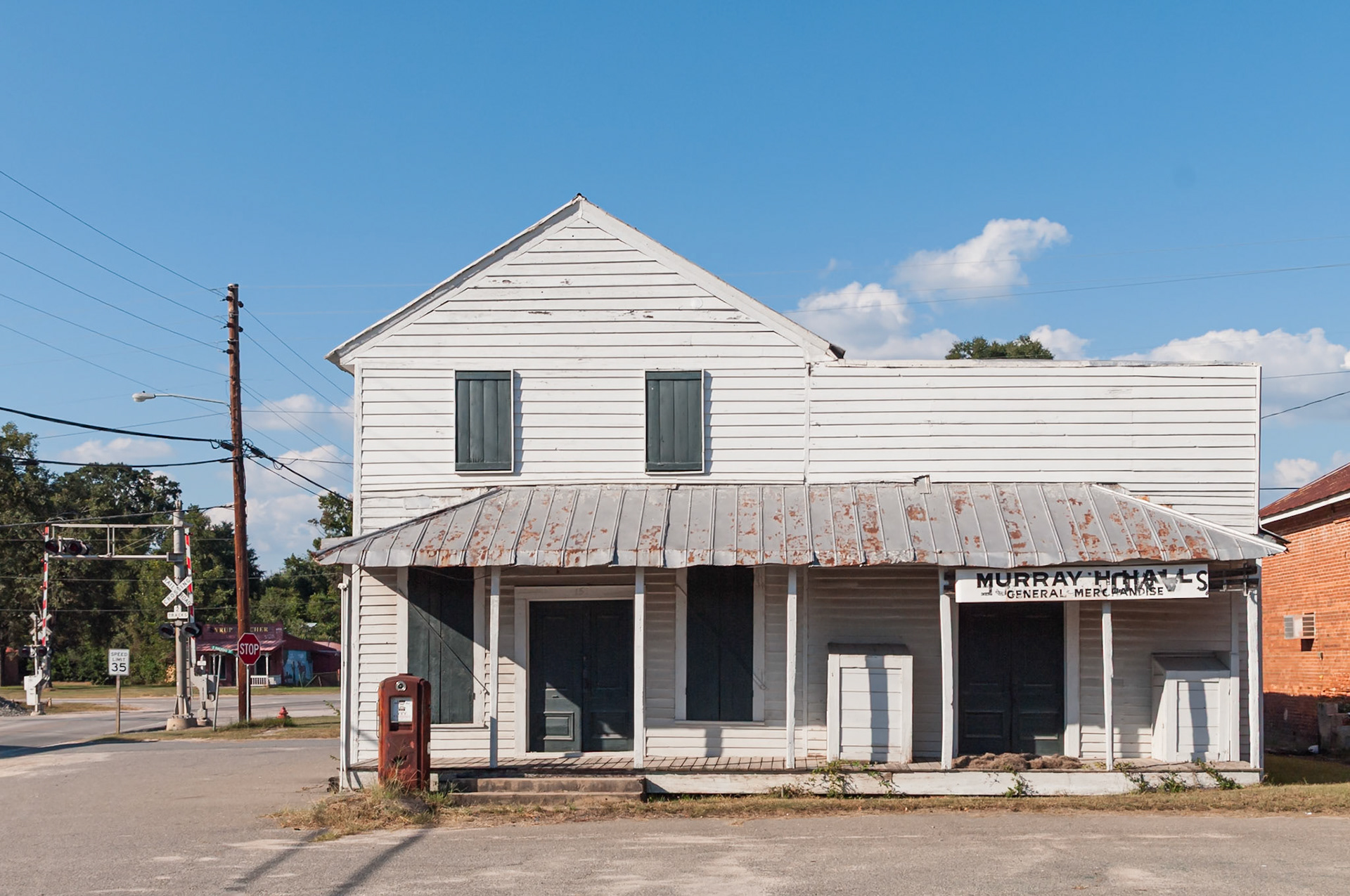 Murray Hall General Merchandise beside the railroad crossing in Toomsboro, Georgia, photographed in September 2013.