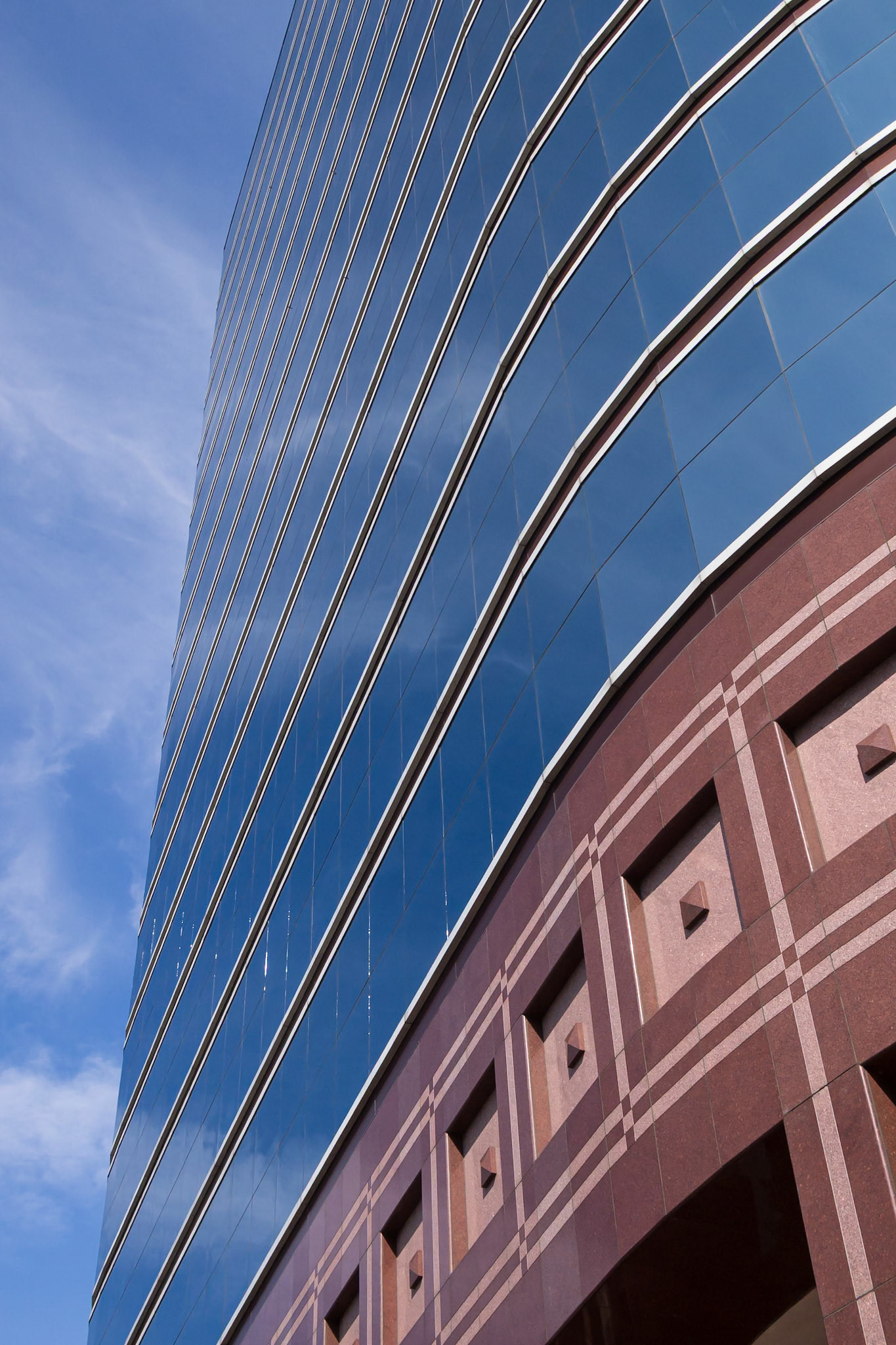 Glass and polished-stone facade of an office building in Midtown Atlanta