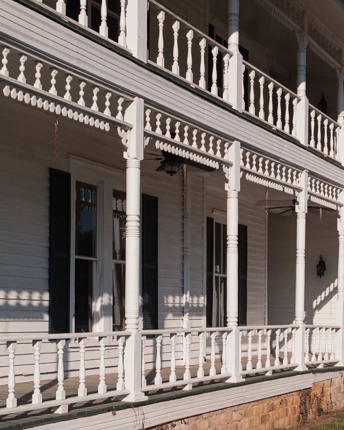 Architectural detail of the Willett Hotel in Toomsboro, Georgia, showing its two-story veranda, photographed in September 2013