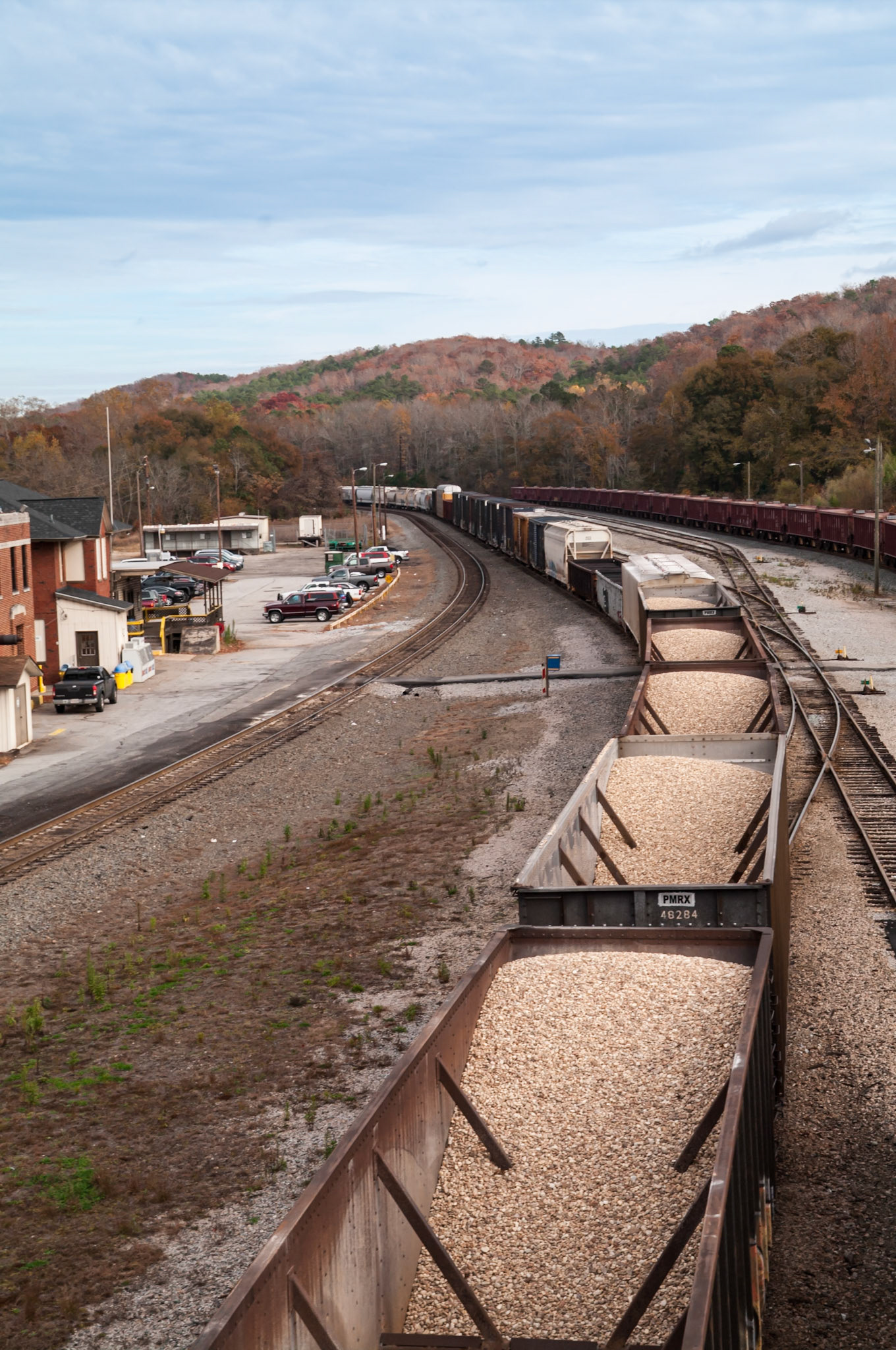 Loaded freight cars and multiple tracks in the railroad yard at Manchester, Georgia, photographed in November 2013