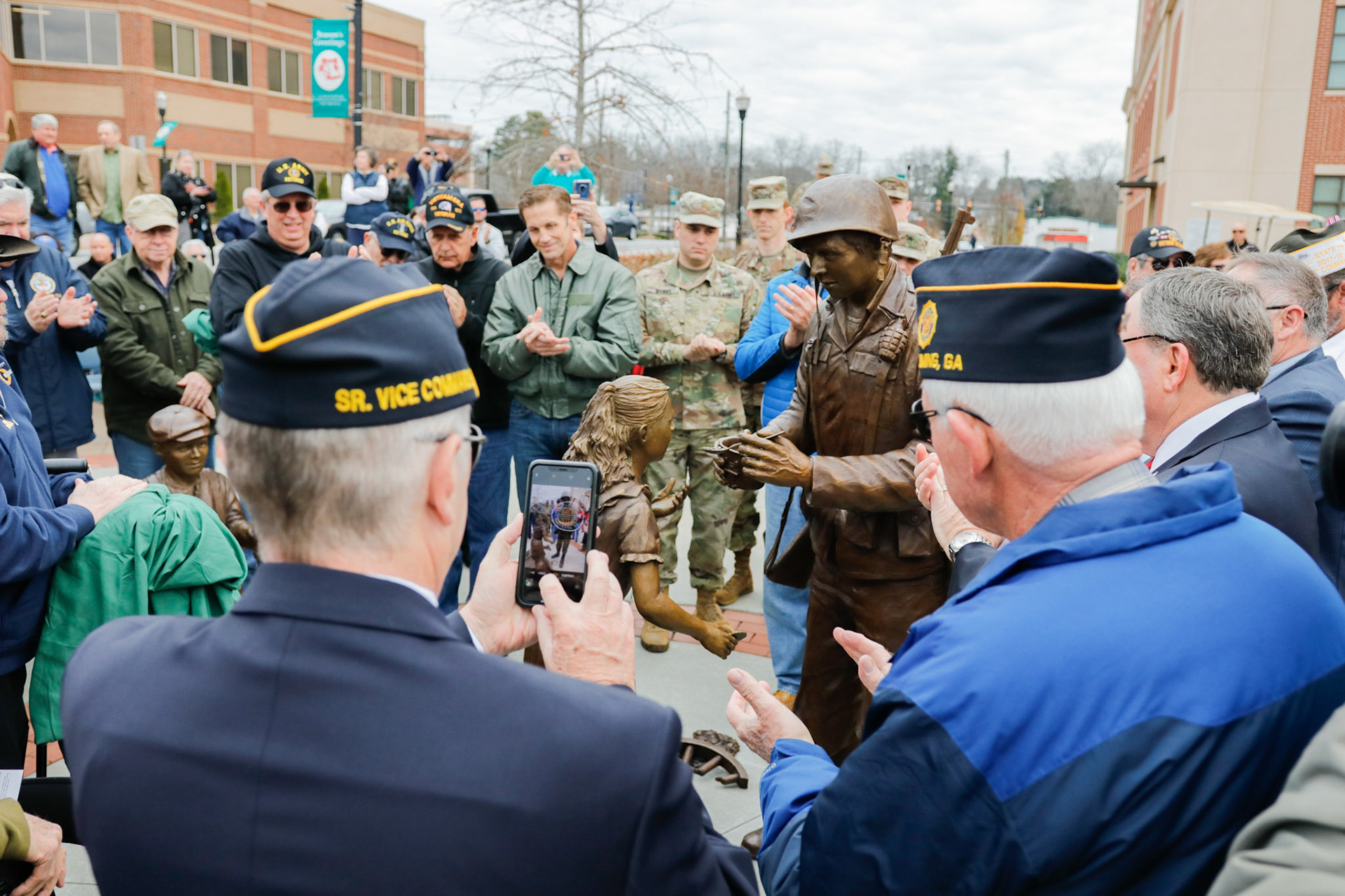 Veterans watch unveiling of statue