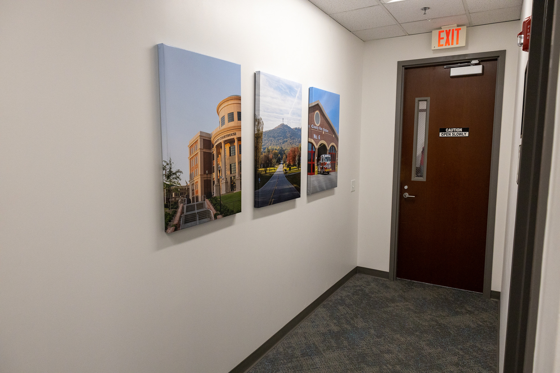 Photos on display on canvas wraps in Forsyth County Board of Commissioners' Suite