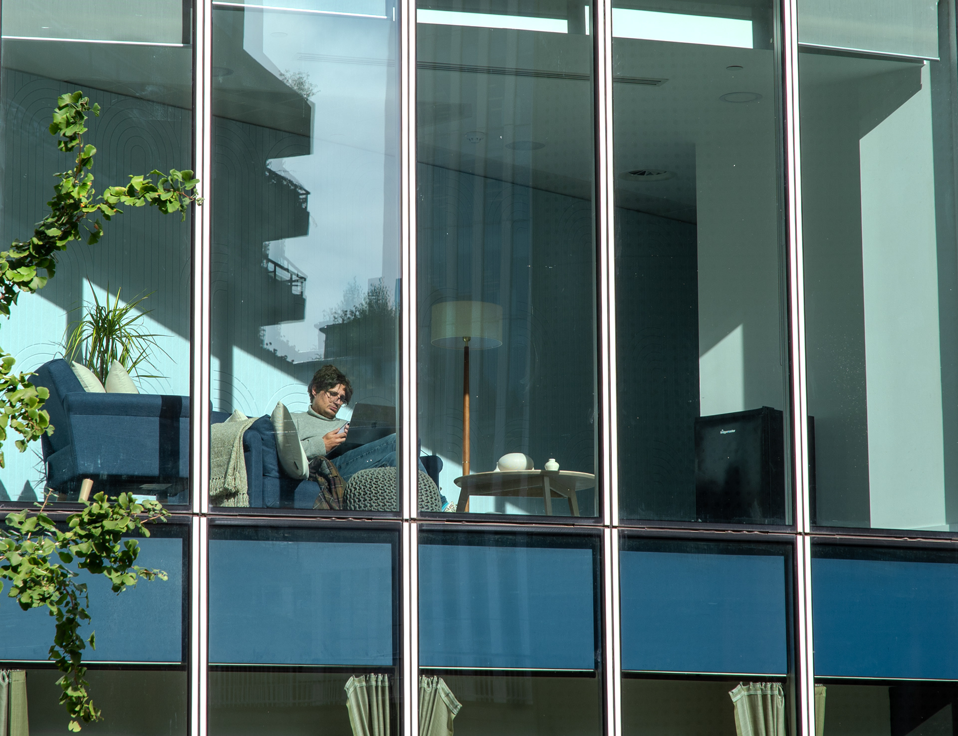 Man in a window, near The Barbican
