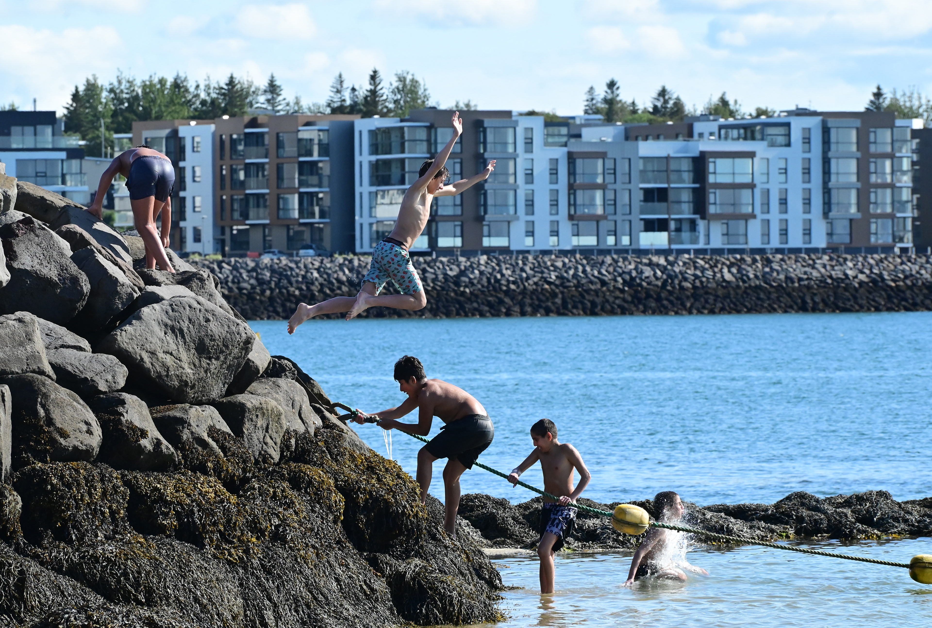 Syrian children at the geothermal beach, Reykjavik