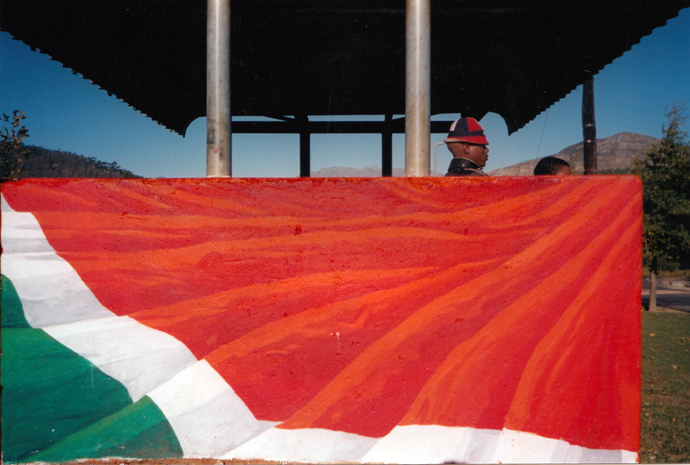 The first version of the same bus stop & concept above, 10 years earlier and back then sponsored by the Belgian-Franschhoek Trust, Groendal, Franschhoek, South-Africa, PVA-paint on plaster.