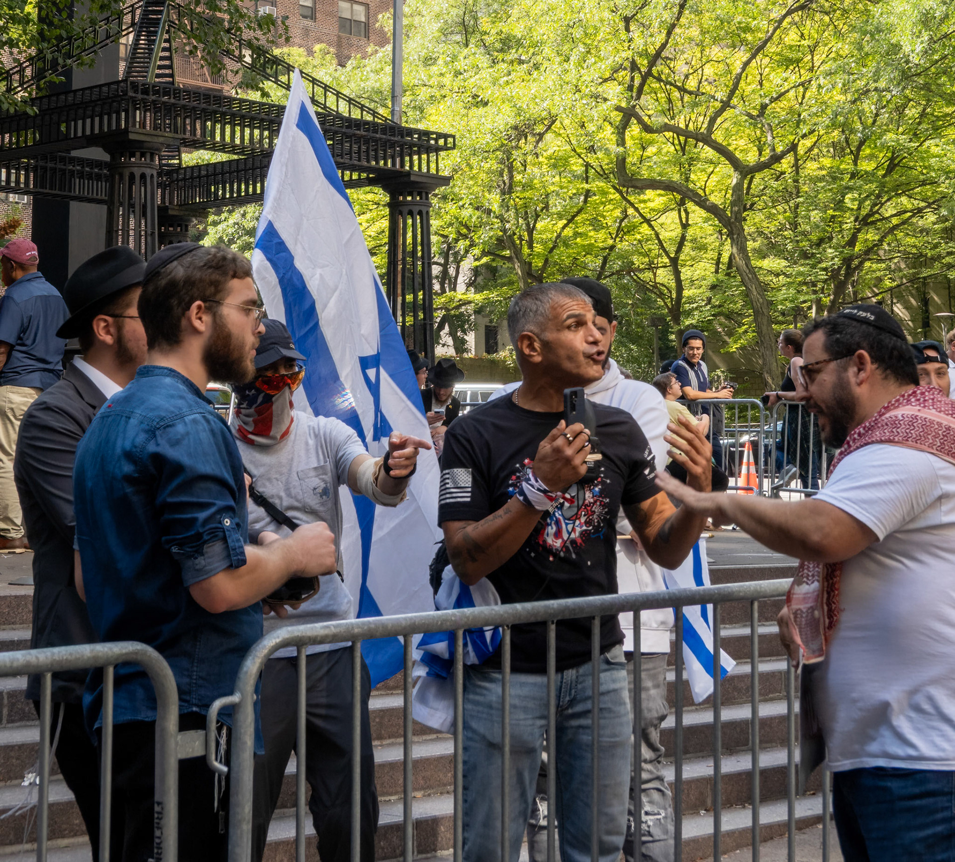 Pro-Israel protestor in discussion with a Jewish person