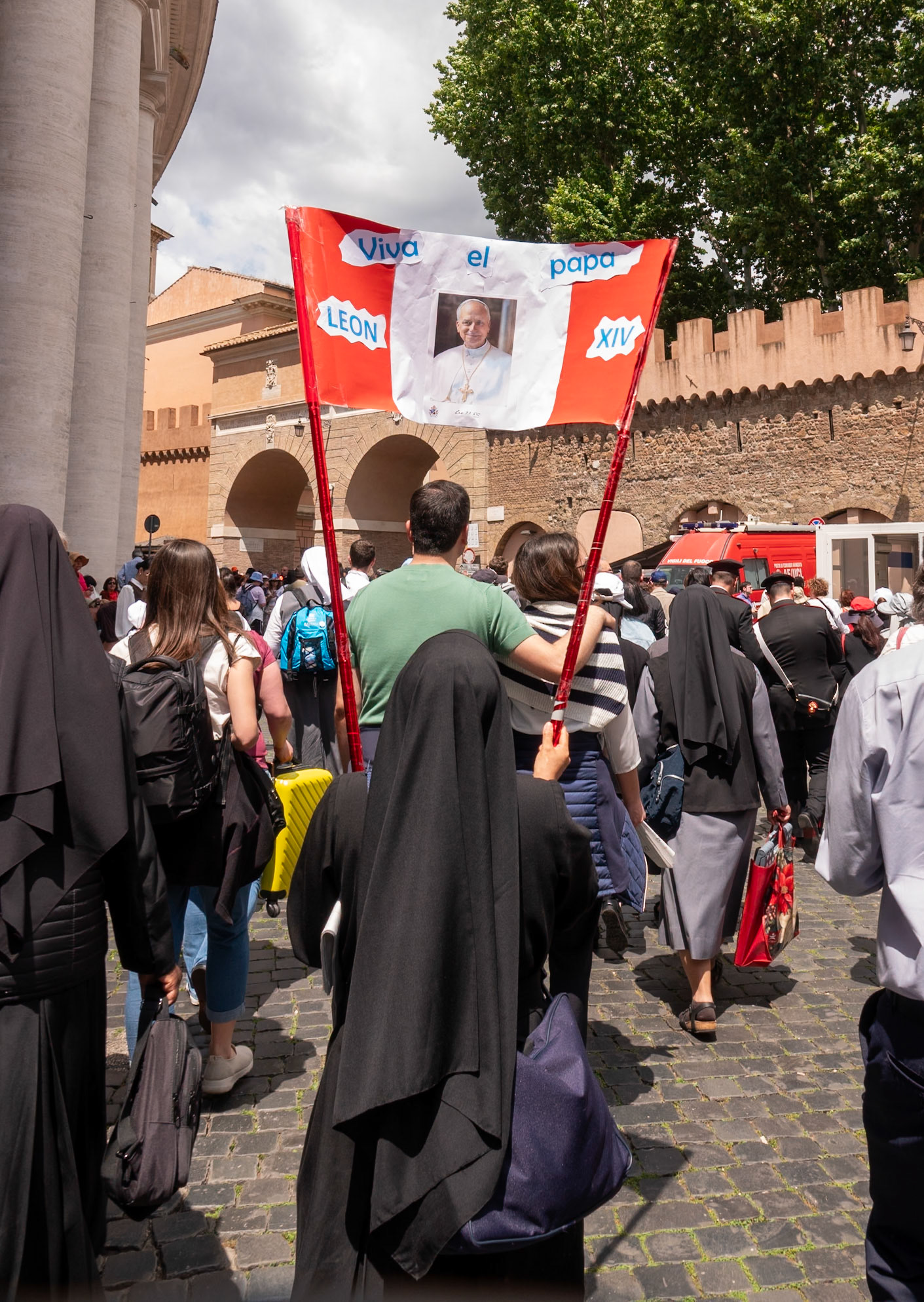 Religious sister, holding up banner, Rome, Italy